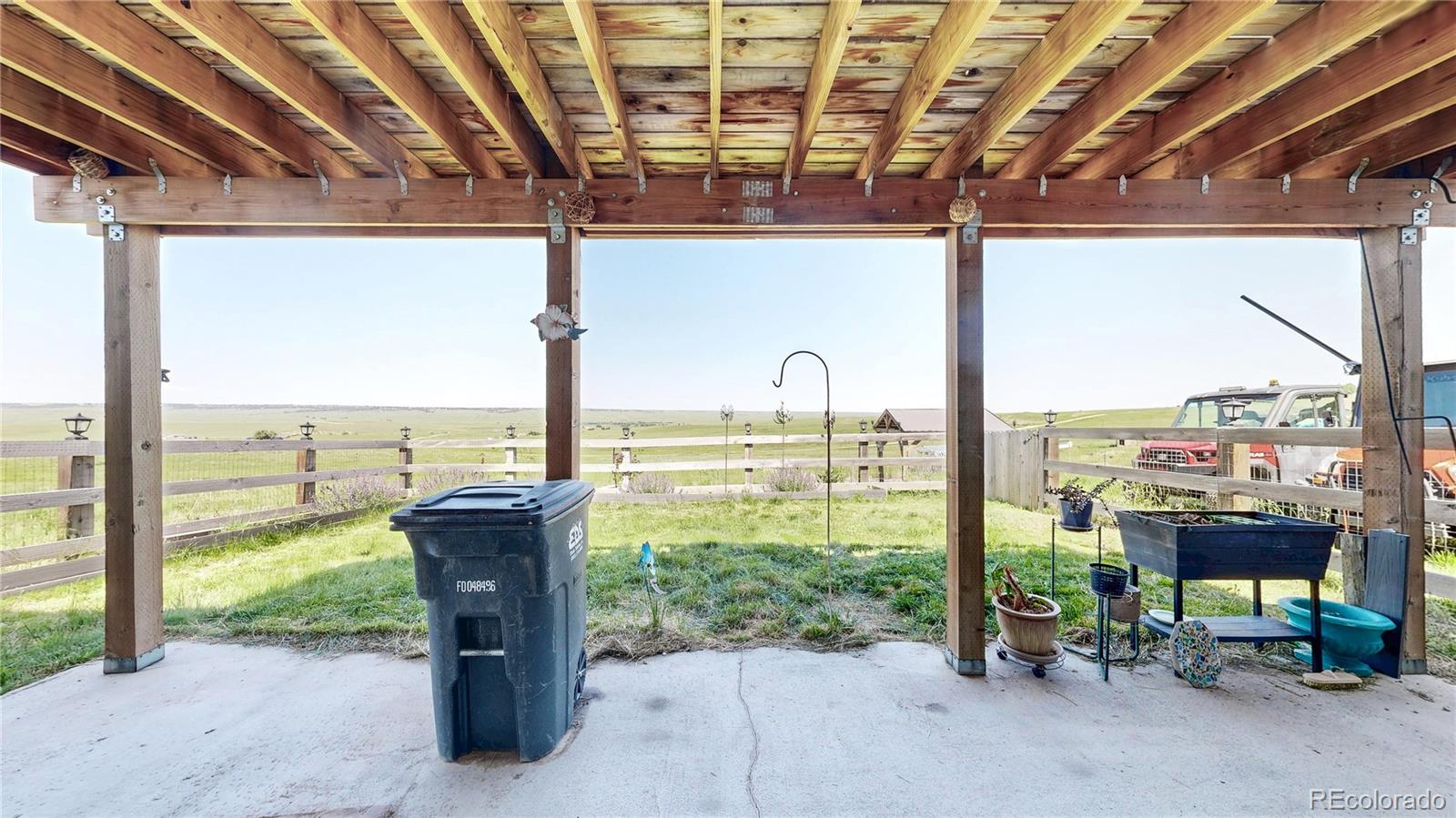40291 Gold Nugget Road Deer Trail, CO 80105 - Photo 35 of 47 a view of a city from a porch