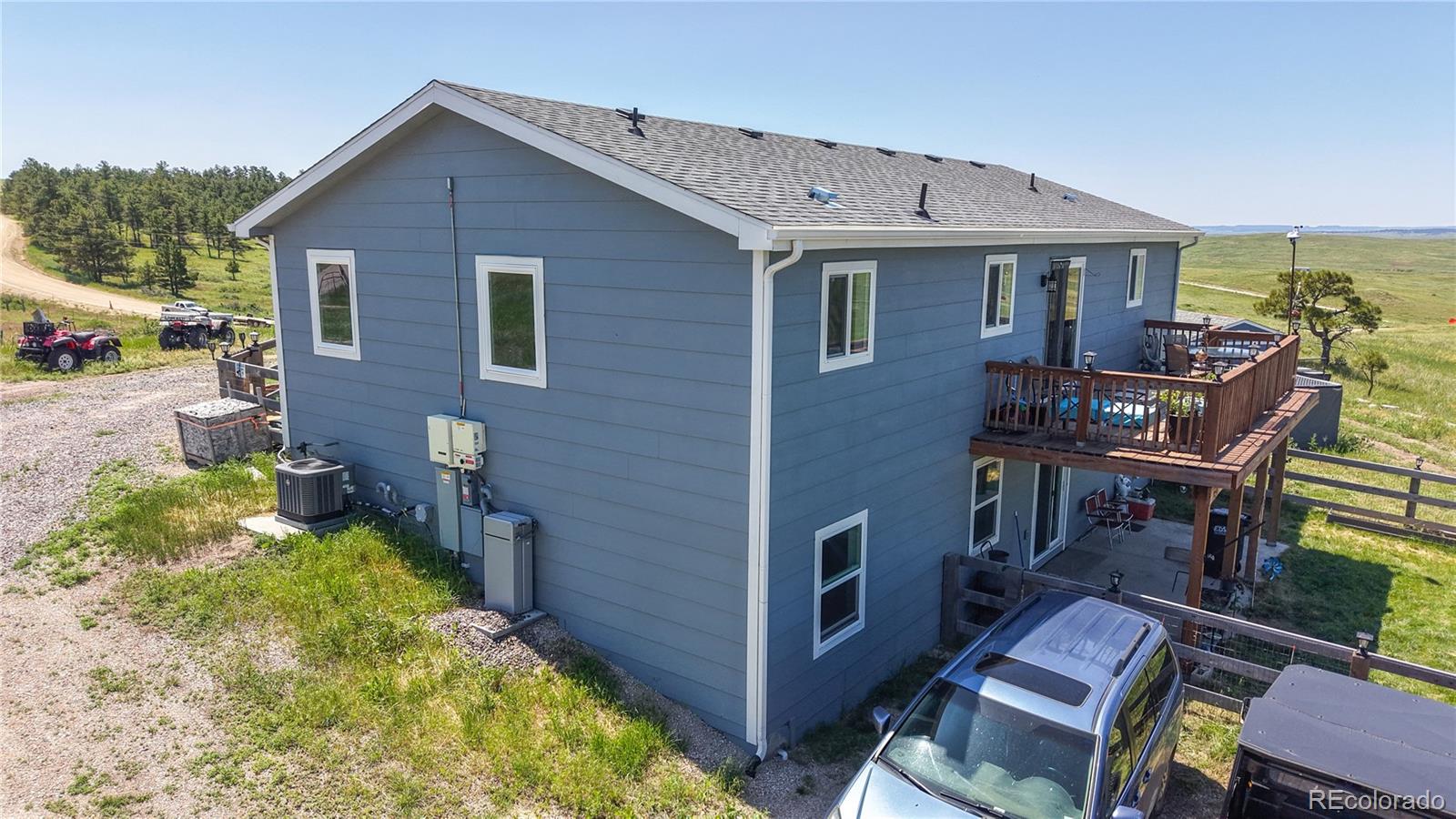 40291 Gold Nugget Road Deer Trail, CO 80105 - Photo 40 of 47 a view of a house with backyard and sitting area
