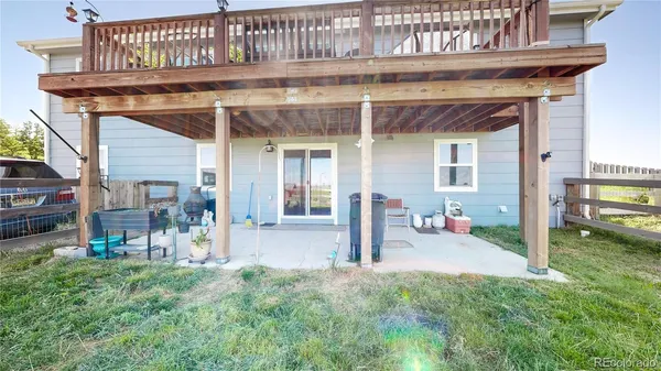 a front view of a house with a yard balcony