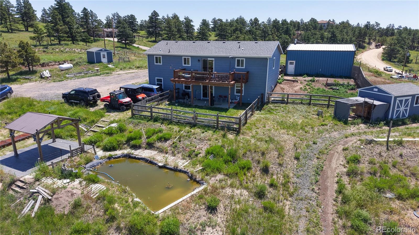 40291 Gold Nugget Road Deer Trail, CO 80105 - Photo 43 of 47 an aerial view of a house with garden space and a patio