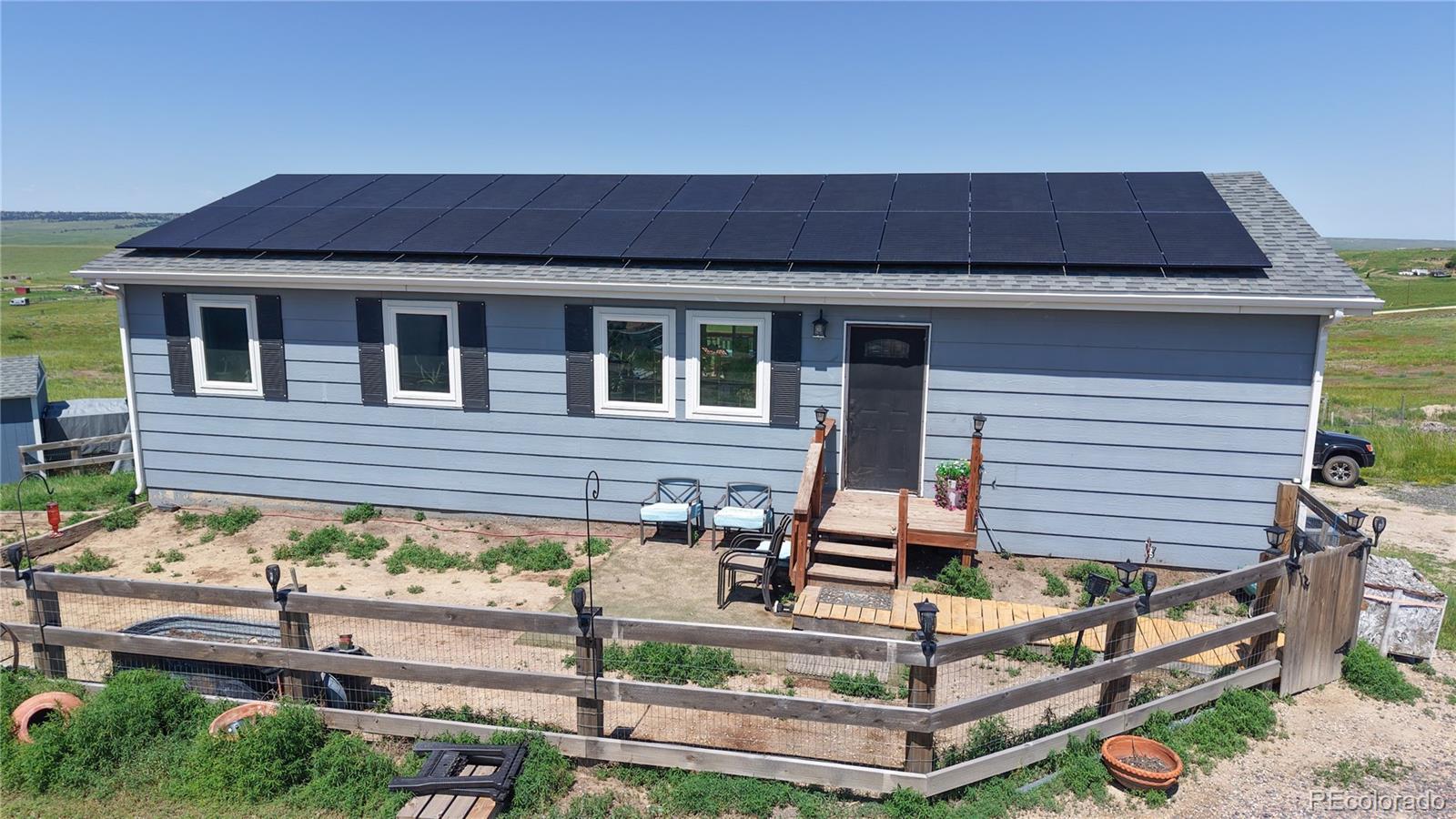 40291 Gold Nugget Road Deer Trail, CO 80105 - Photo 6 of 47 a front view of a house with garage