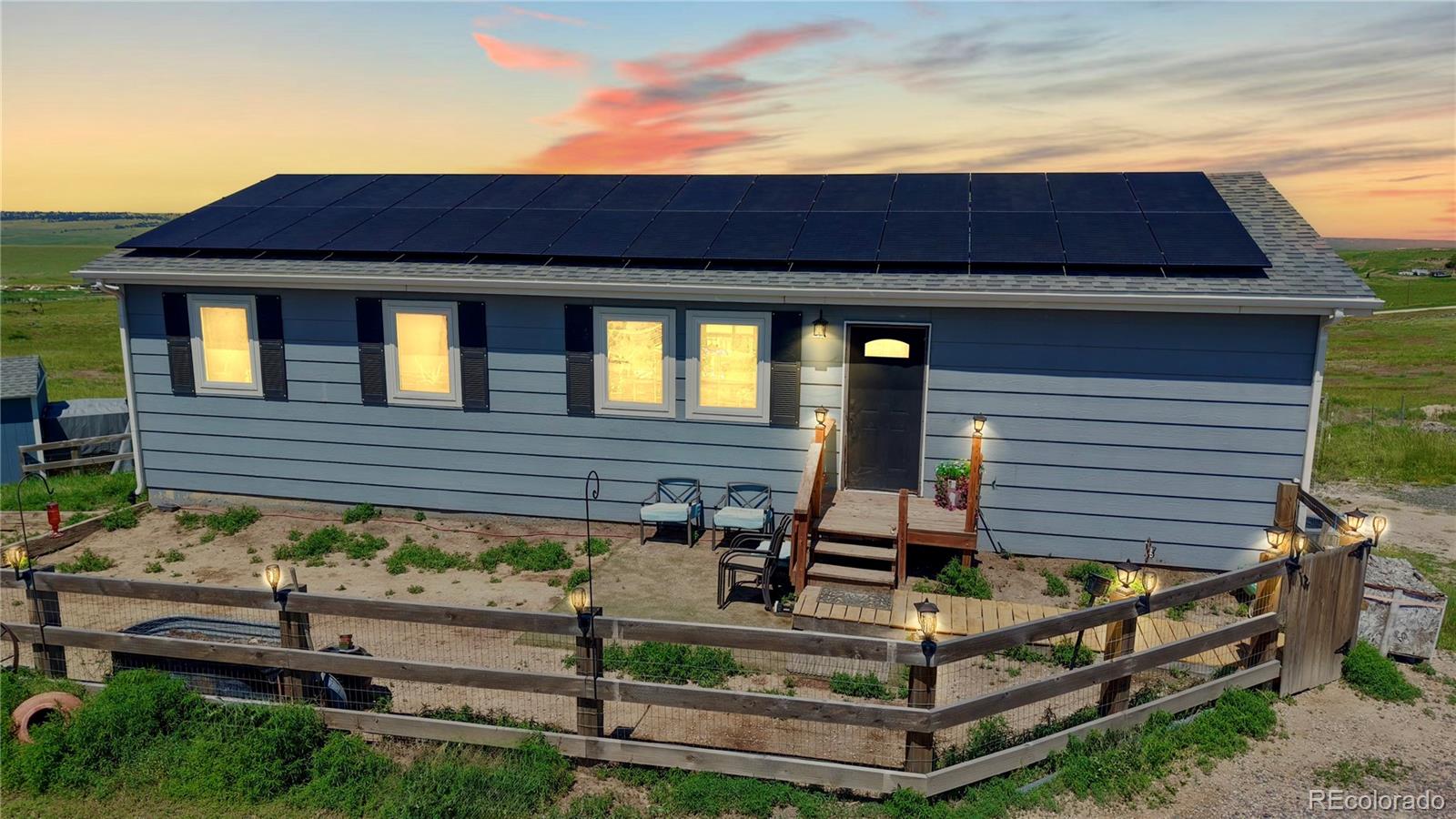 40291 Gold Nugget Road Deer Trail, CO 80105 - Photo 7 of 47 a front view of a house with a yard