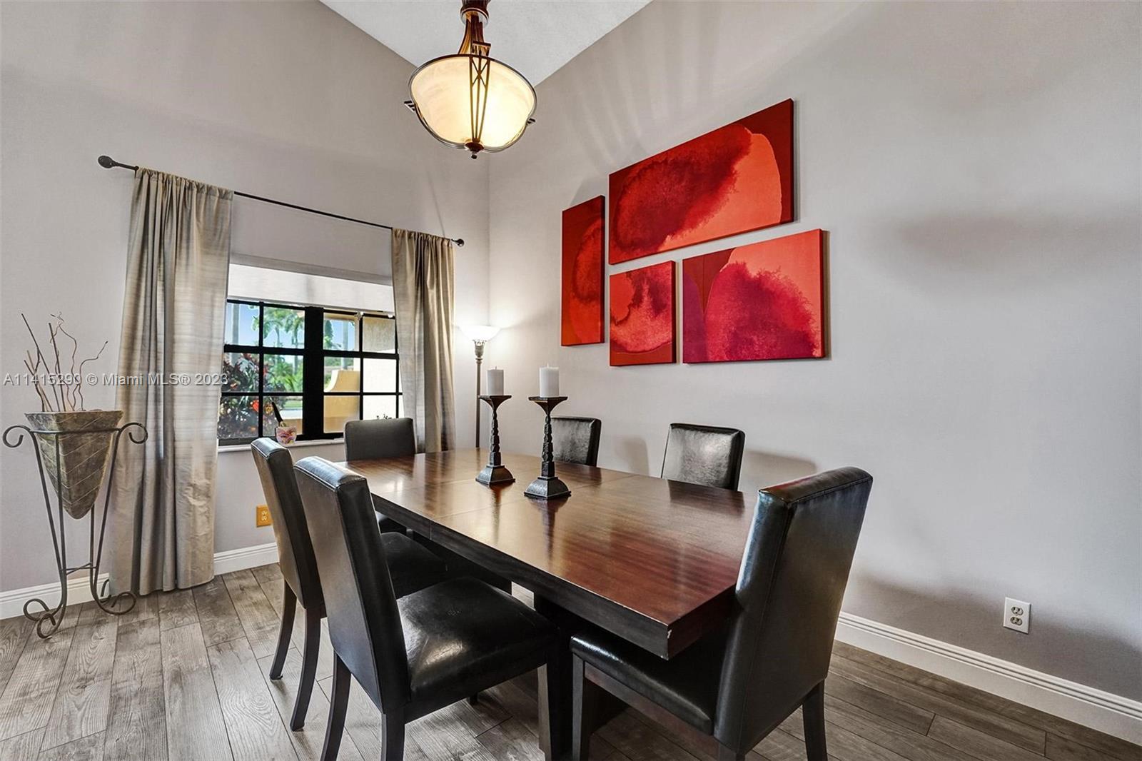 9641 Ridgeside Court Davie, FL 33328 - Photo 16 of 78 a view of a dining room with furniture wooden floor and chandelier