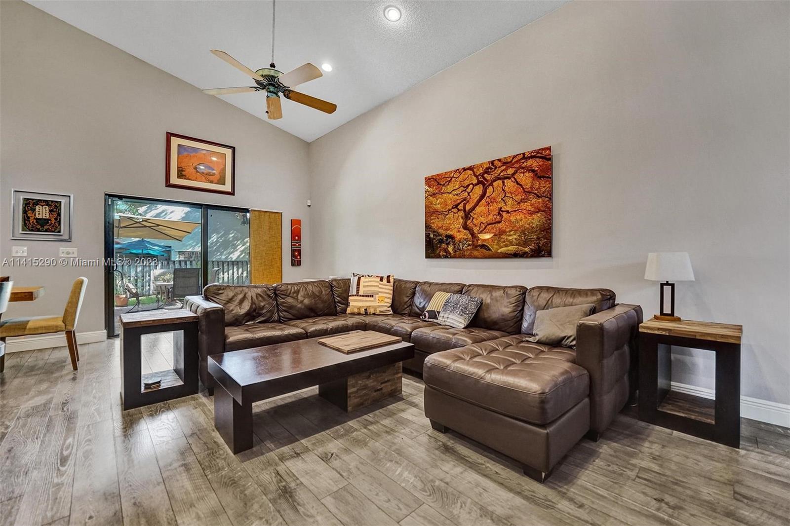 9641 Ridgeside Court Davie, FL 33328 - Photo 18 of 78 a living room with furniture and a wooden floor