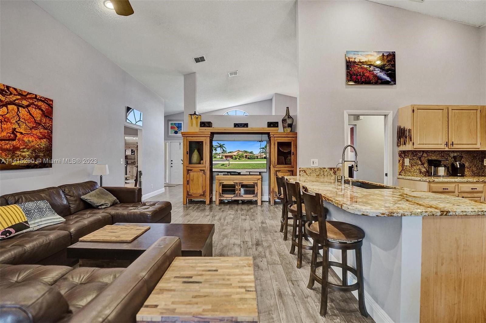 9641 Ridgeside Court Davie, FL 33328 - Photo 34 of 78 a living room with furniture and a wooden floor