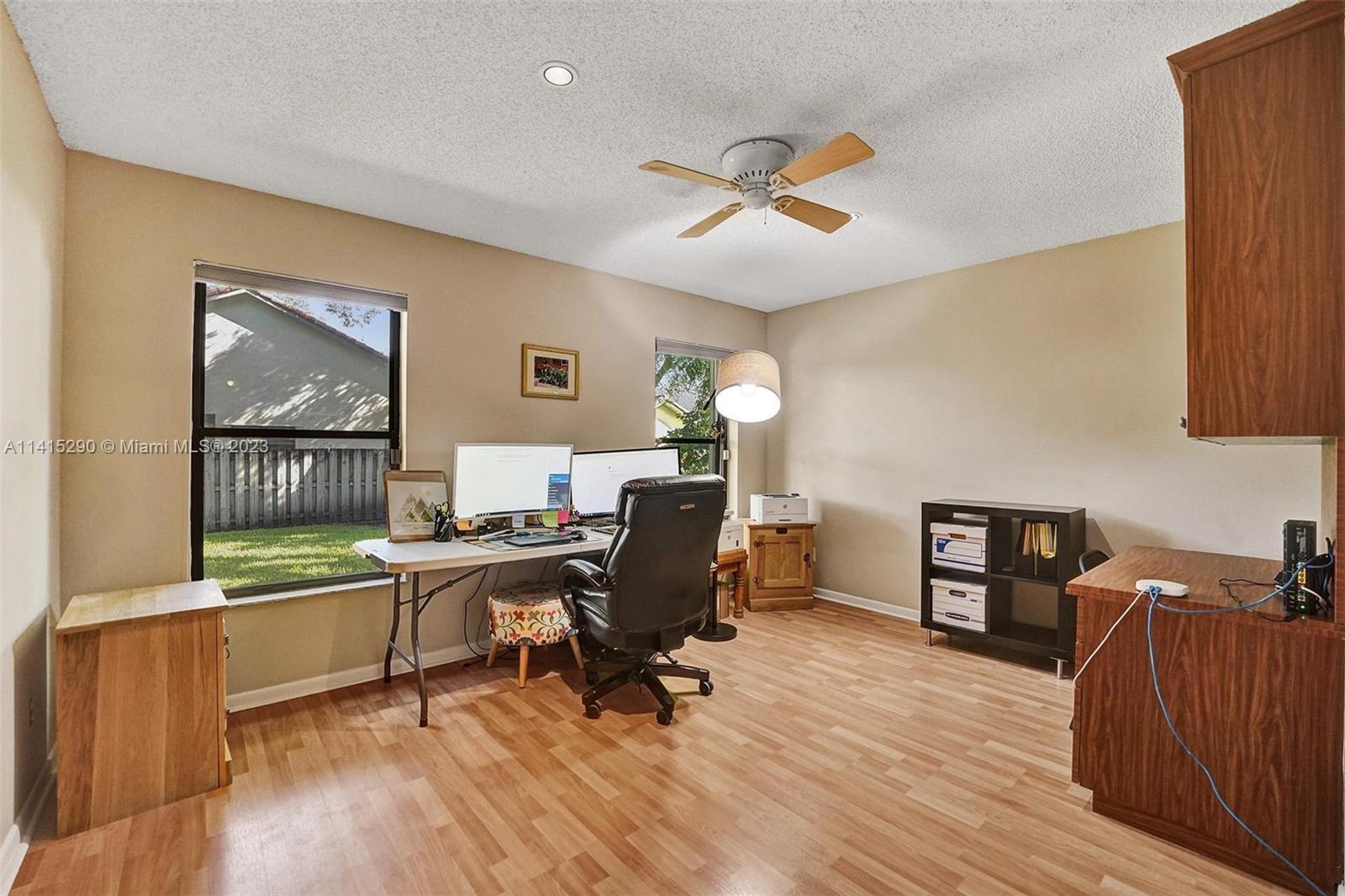 9641 Ridgeside Court Davie, FL 33328 - Photo 35 of 78 a view of a workspace with furniture and a window