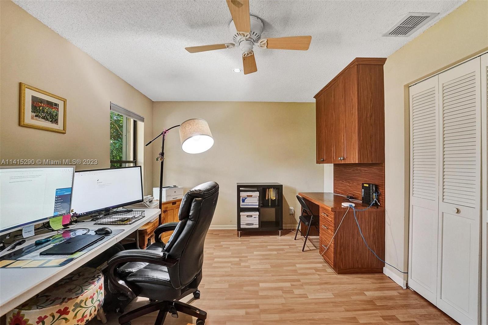 9641 Ridgeside Court Davie, FL 33328 - Photo 36 of 78 a workspace with furniture and wooden floor