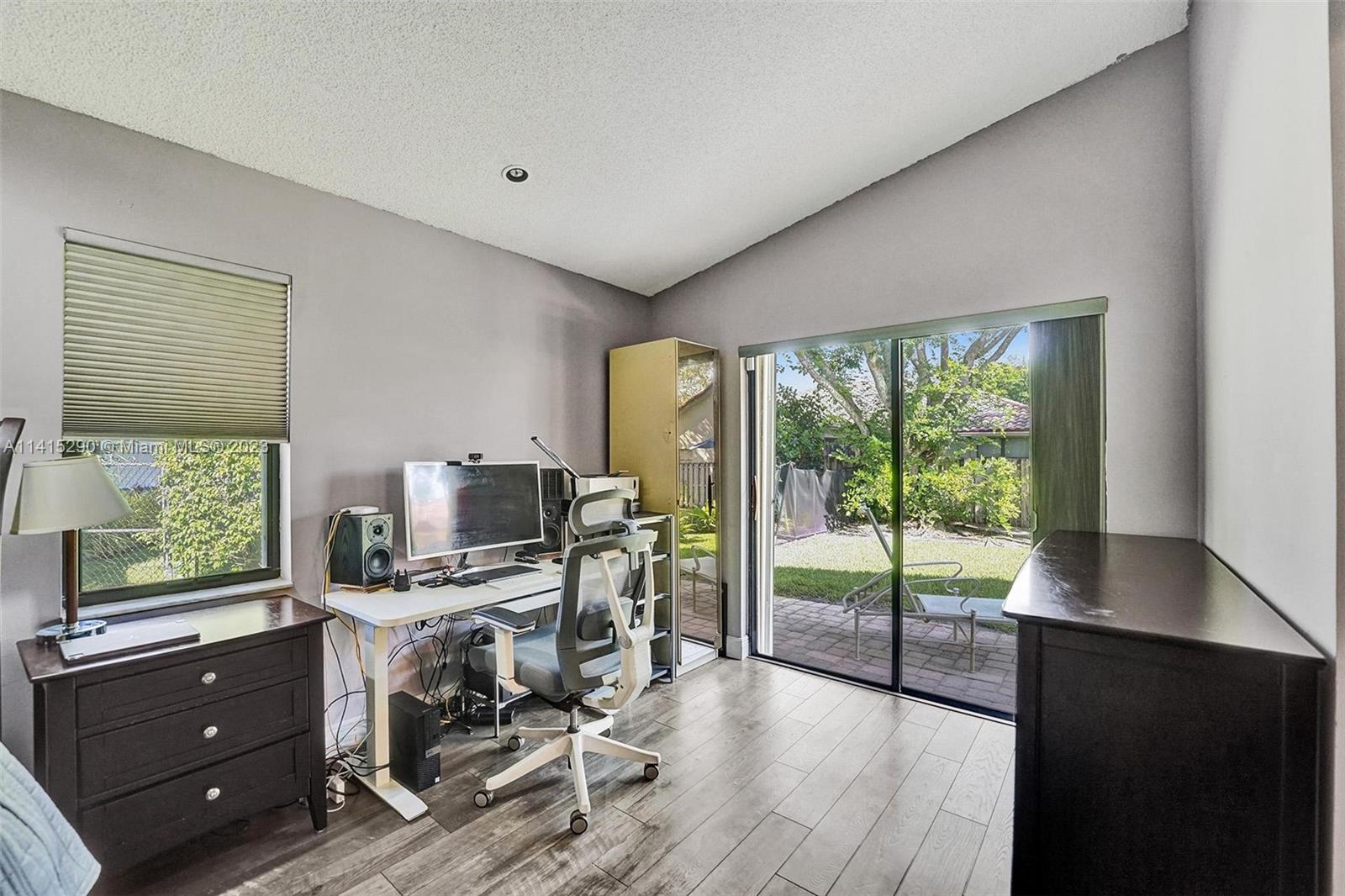 9641 Ridgeside Court Davie, FL 33328 - Photo 45 of 78 a view of a workspace with furniture and a window