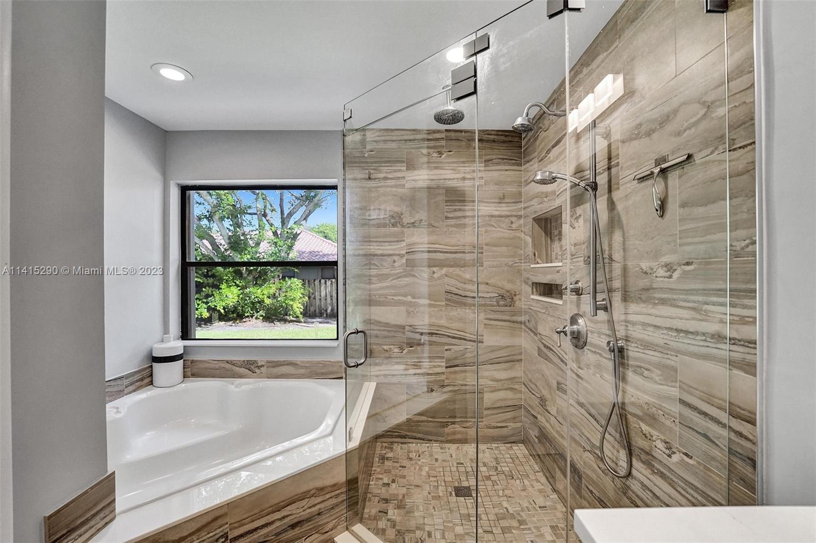 9641 Ridgeside Court Davie, FL 33328 - Photo 50 of 78 a bathroom with a bathtub and shower