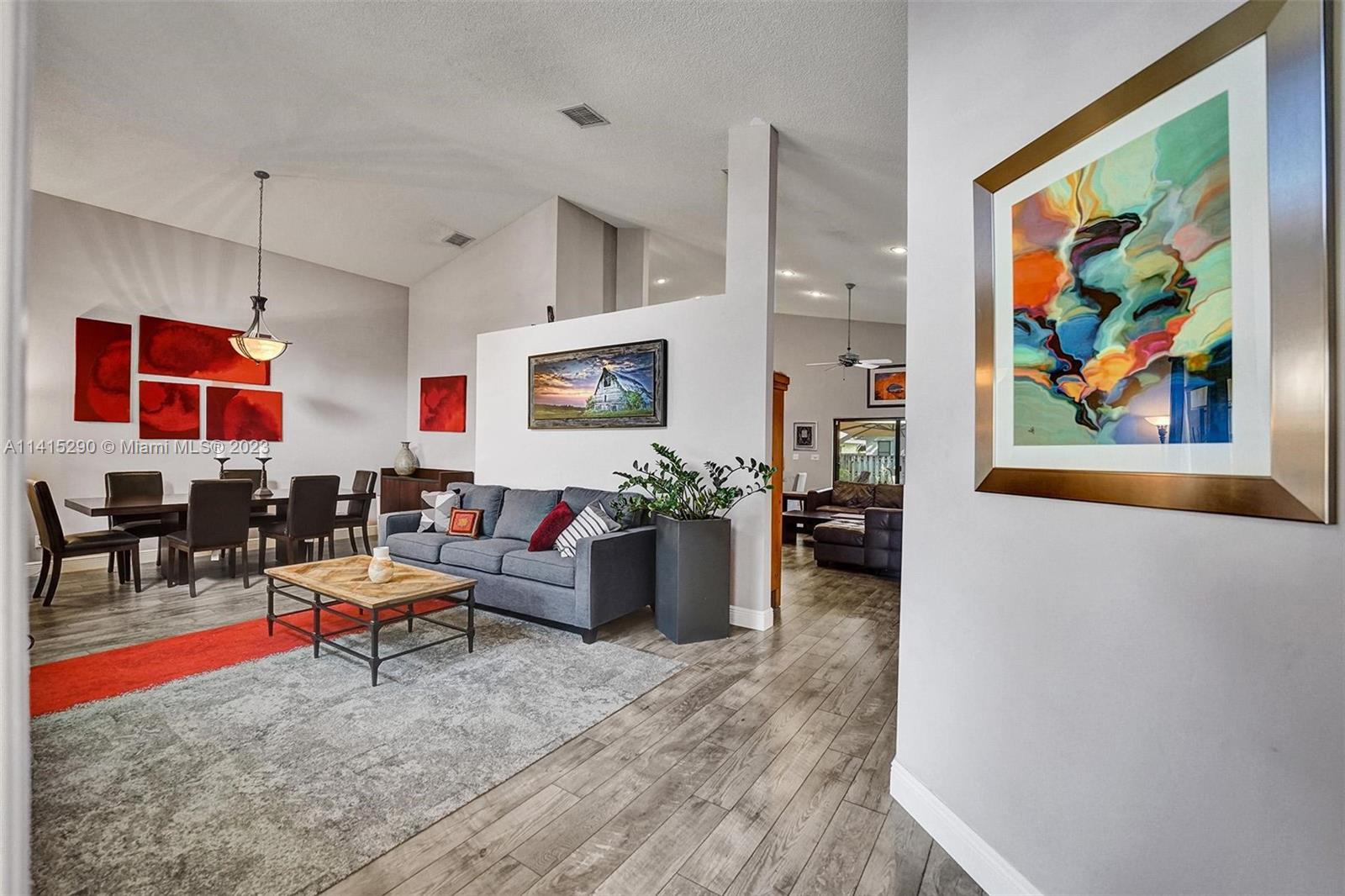 9641 Ridgeside Court Davie, FL 33328 - Photo 5 of 78 a living room with furniture and a flat screen tv