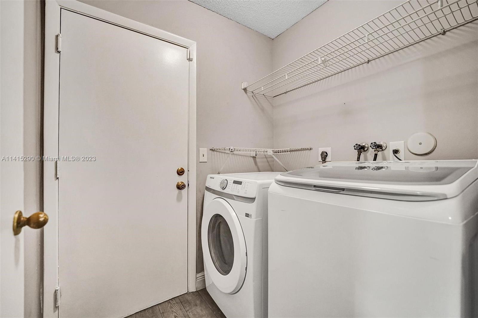 9641 Ridgeside Court Davie, FL 33328 - Photo 60 of 78 a utility room with dryer and washer
