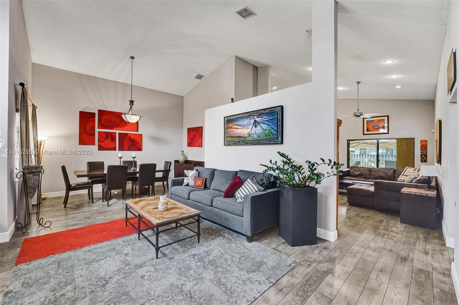 9641 Ridgeside Court Davie, FL 33328 - Photo 6 of 78 a living room with furniture and a flat screen tv