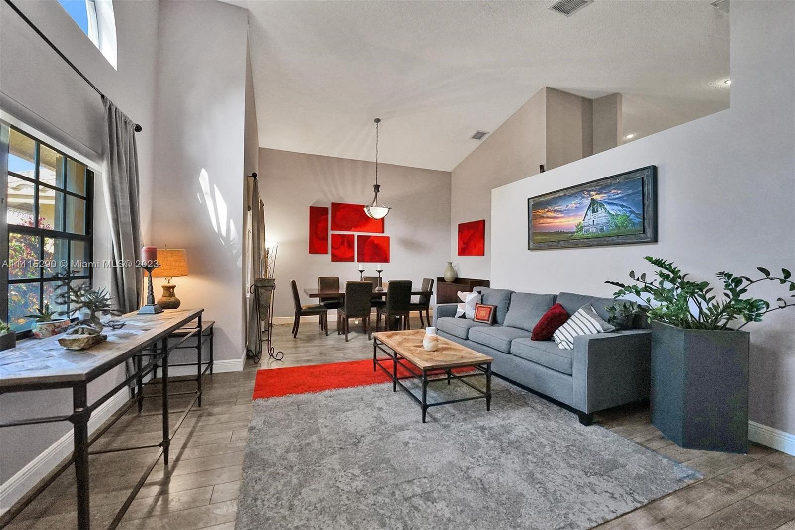 9641 Ridgeside Court Davie, FL 33328 - Photo 7 of 78 a living room with furniture and a potted plant