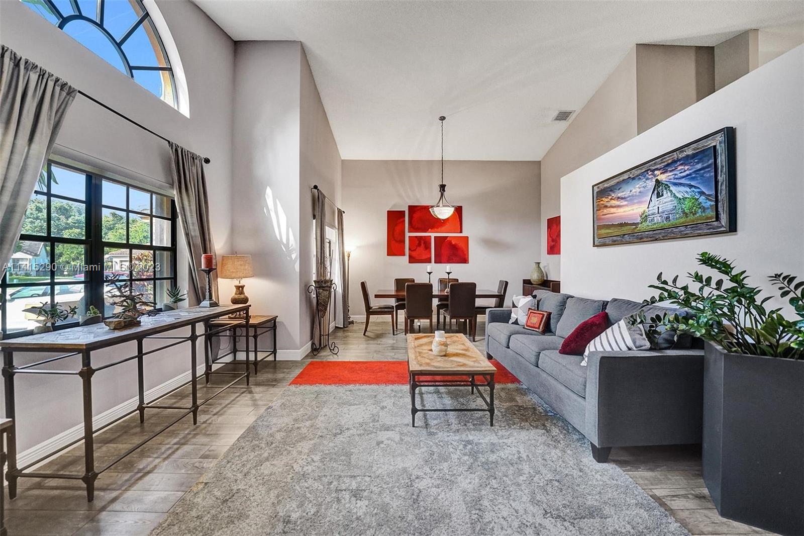 9641 Ridgeside Court Davie, FL 33328 - Photo 8 of 78 a living room with furniture and a flat screen tv