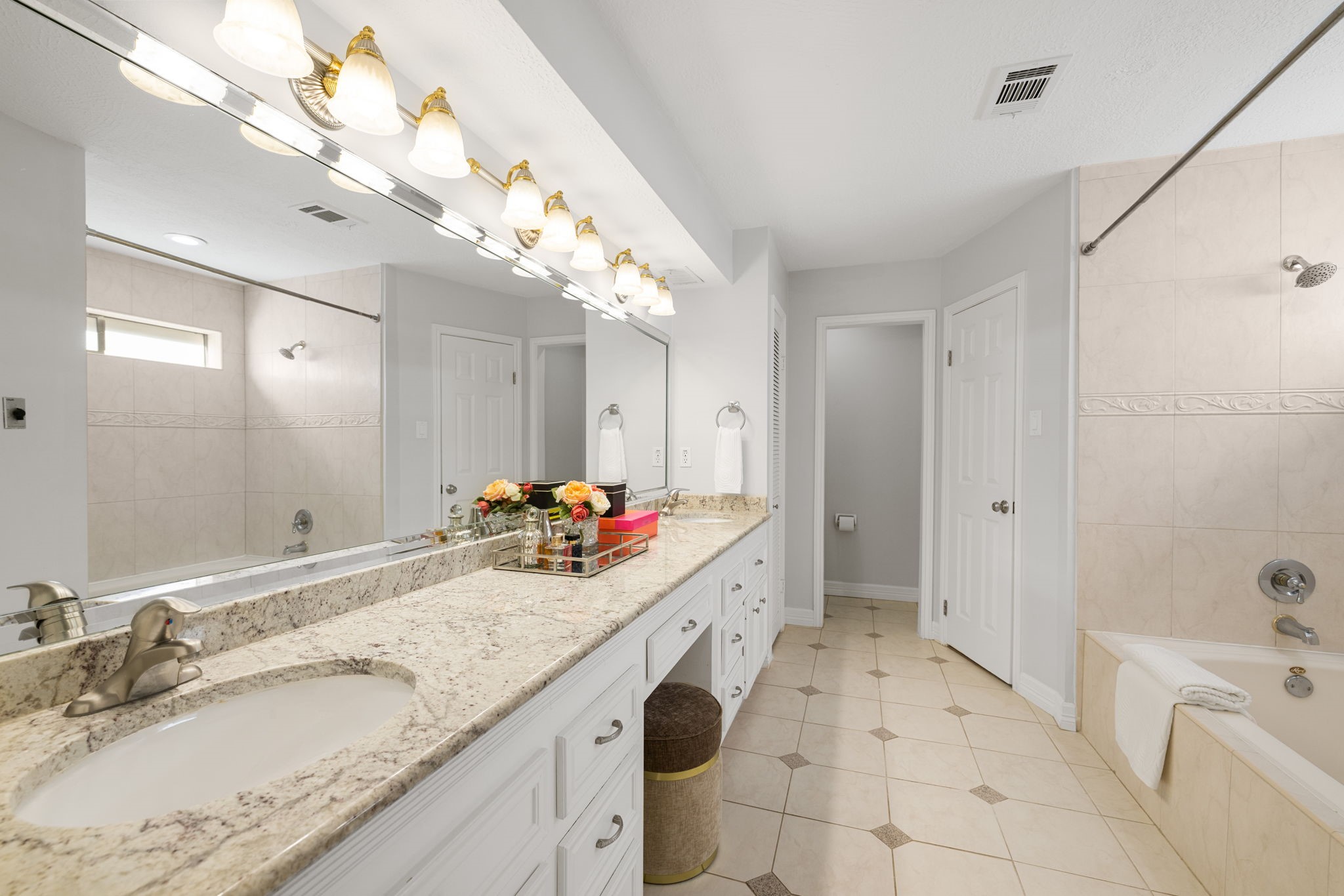 9203 Godstone Lane Spring, TX 77379 - Photo 24 of 49 The ensuite Bathroom is large – providing plenty of granite counter space for each of you during the busy morning rush. There are dual undermounted sinks, a full-width mirror, two large walk-in closets, cabinets, multiple drawers and a storage tower. This Lease home is a dream.