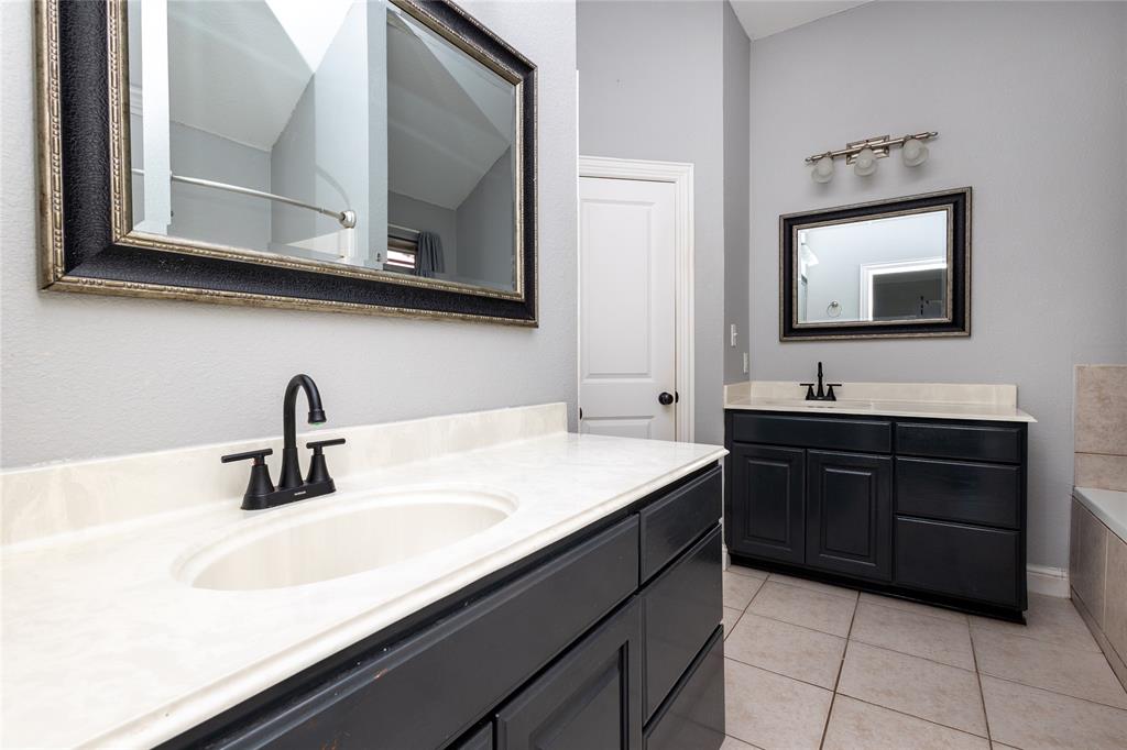 512 Milton Road Josephine, TX 75173 - Photo 14 of 31 a bathroom with a sink and a mirror