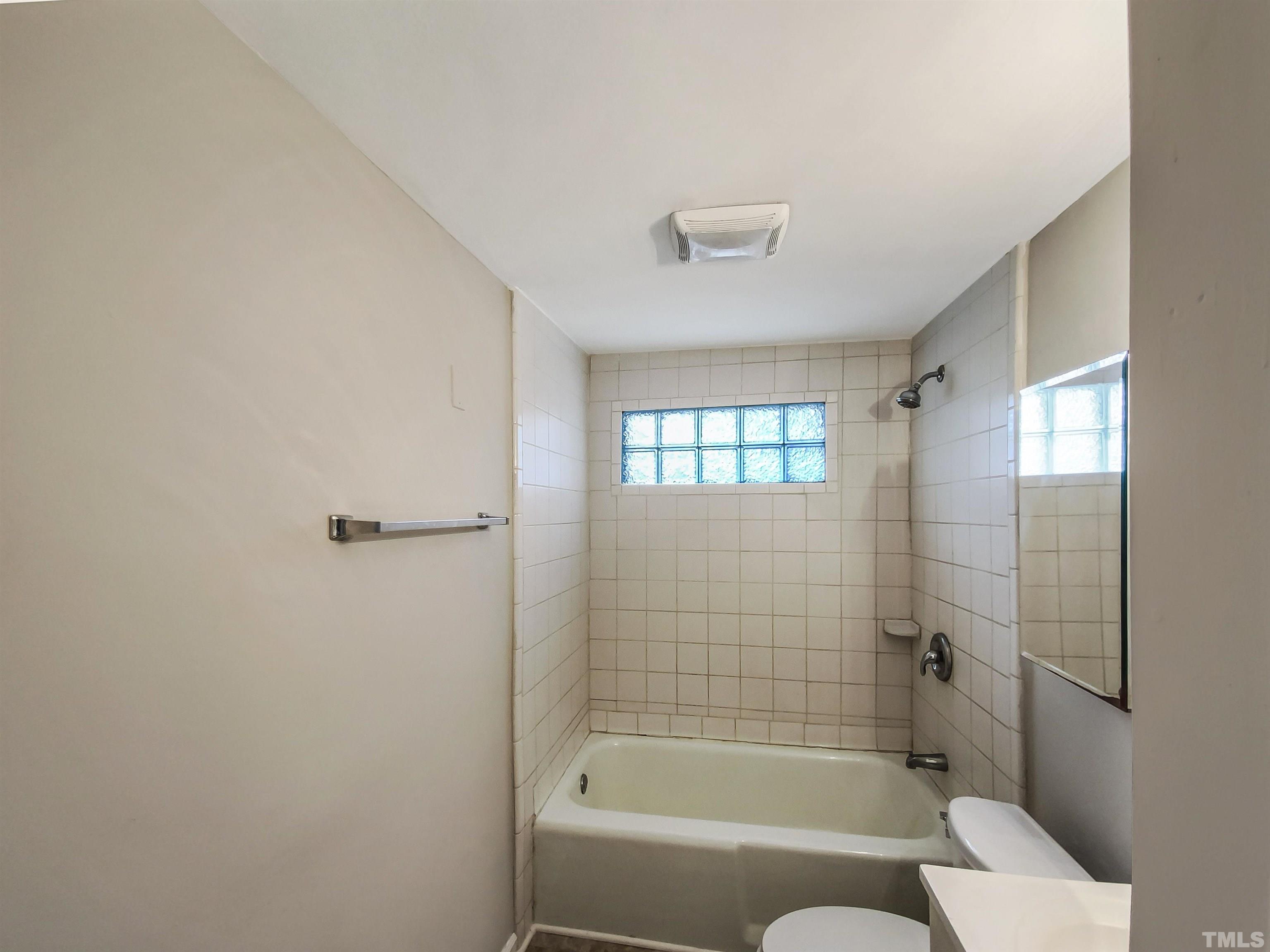 1521 Wiljohn Road Garner, NC 27529 - Photo 11 of 20 a bathroom with a bathtub and shower