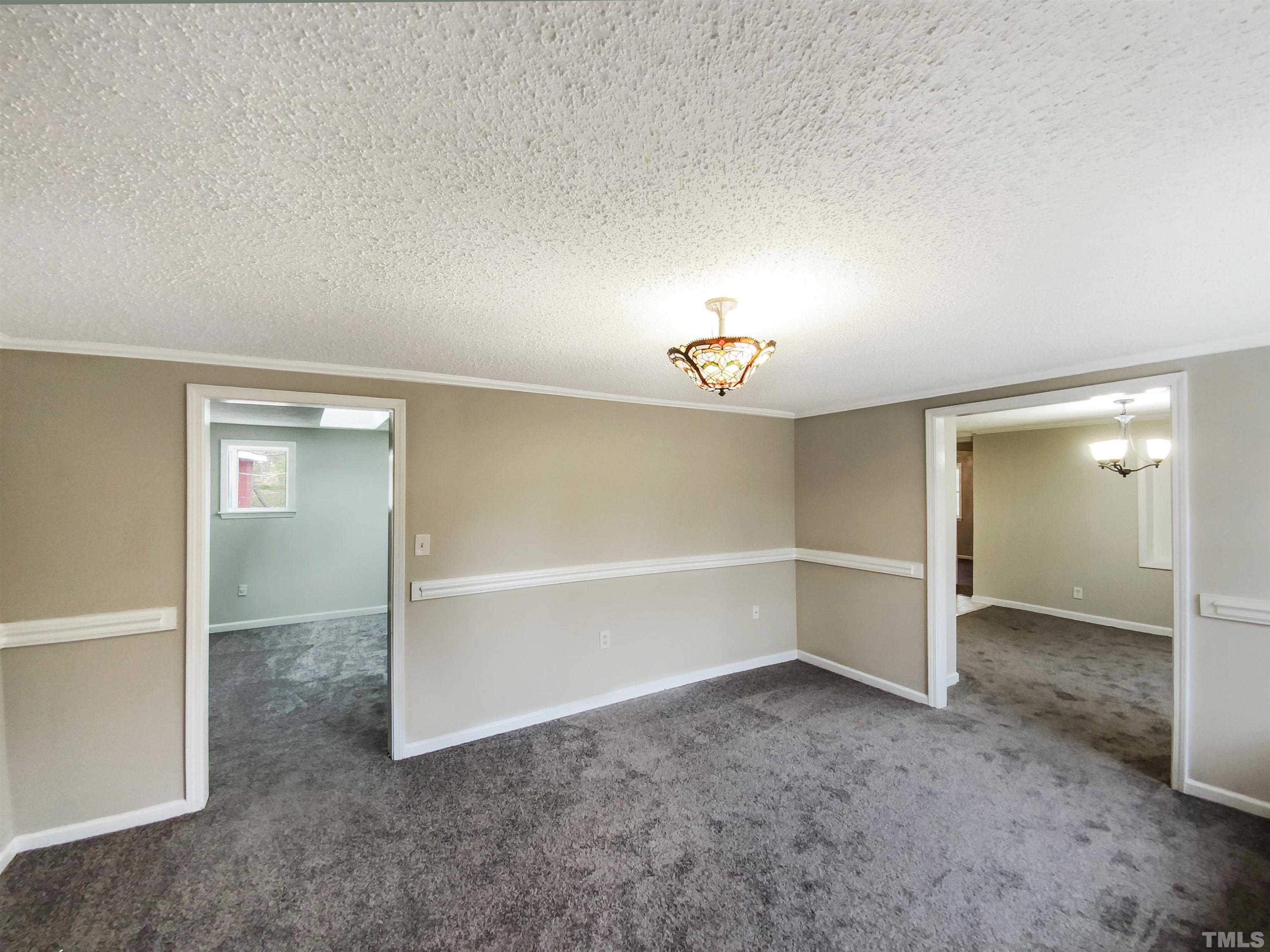 1521 Wiljohn Road Garner, NC 27529 - Photo 16 of 20 an empty room with a empty space and windows