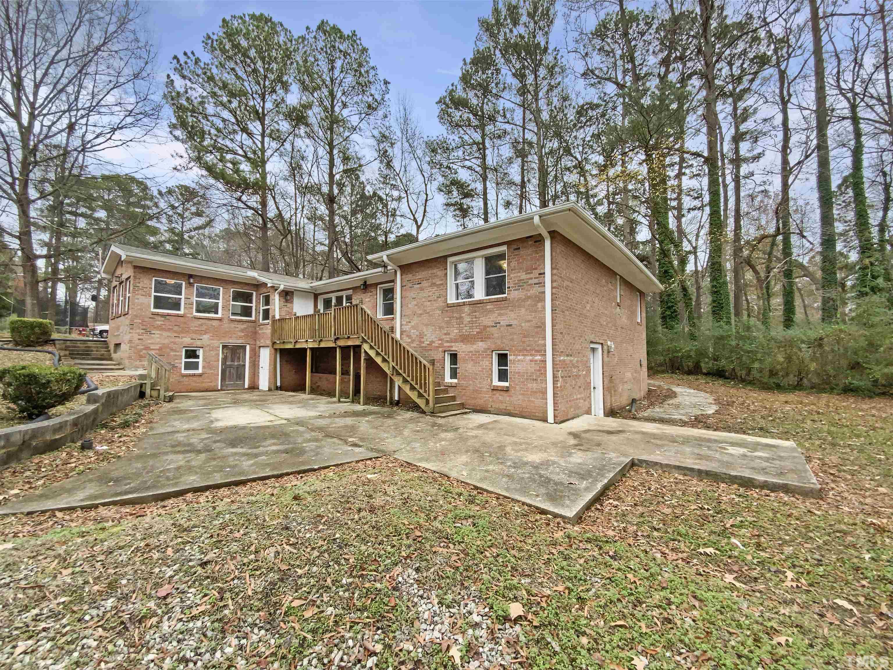 1521 Wiljohn Road Garner, NC 27529 - Photo 17 of 20 a view of a house with a yard covered in snow