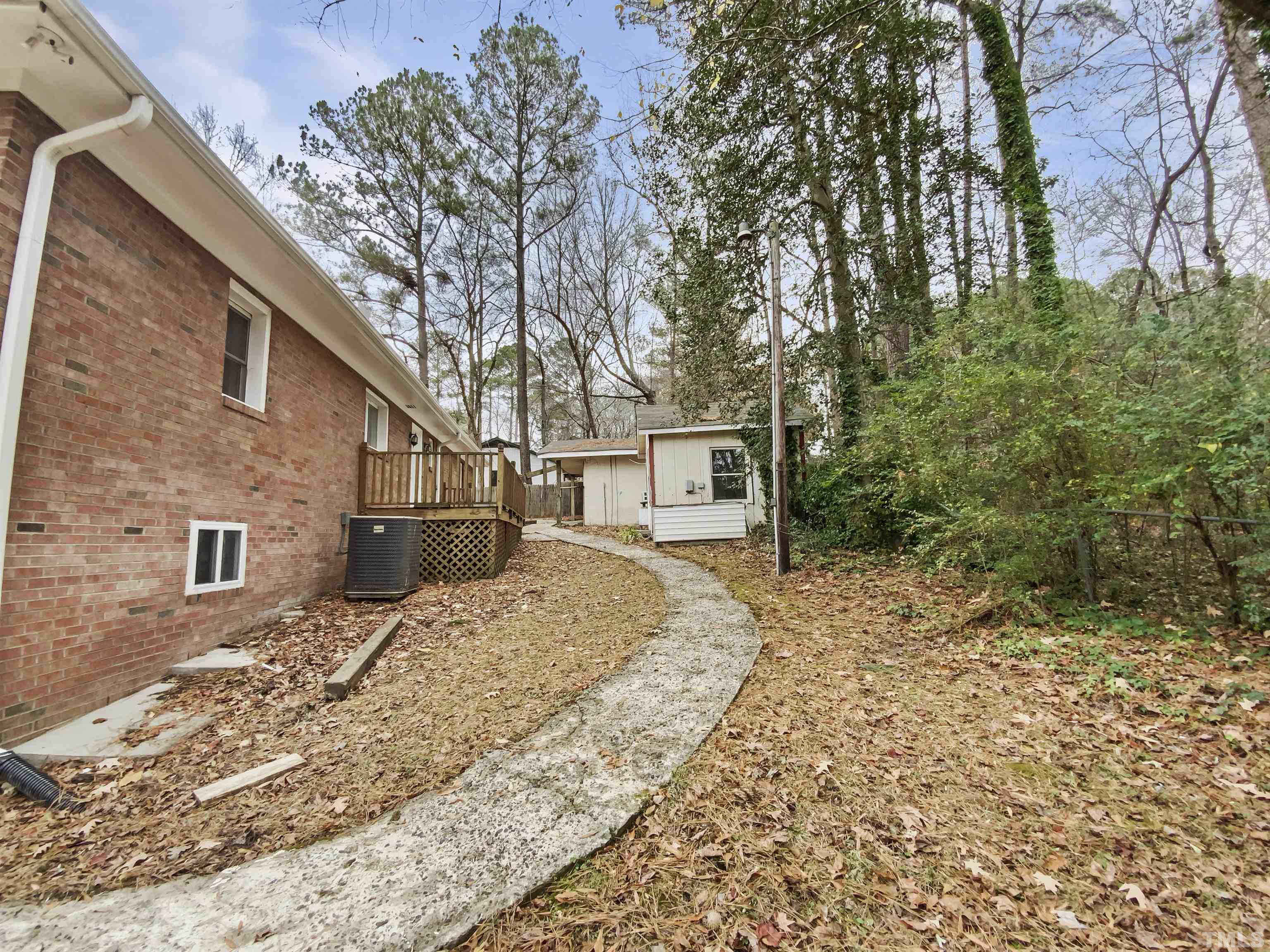 1521 Wiljohn Road Garner, NC 27529 - Photo 18 of 20 a view of a house with a yard