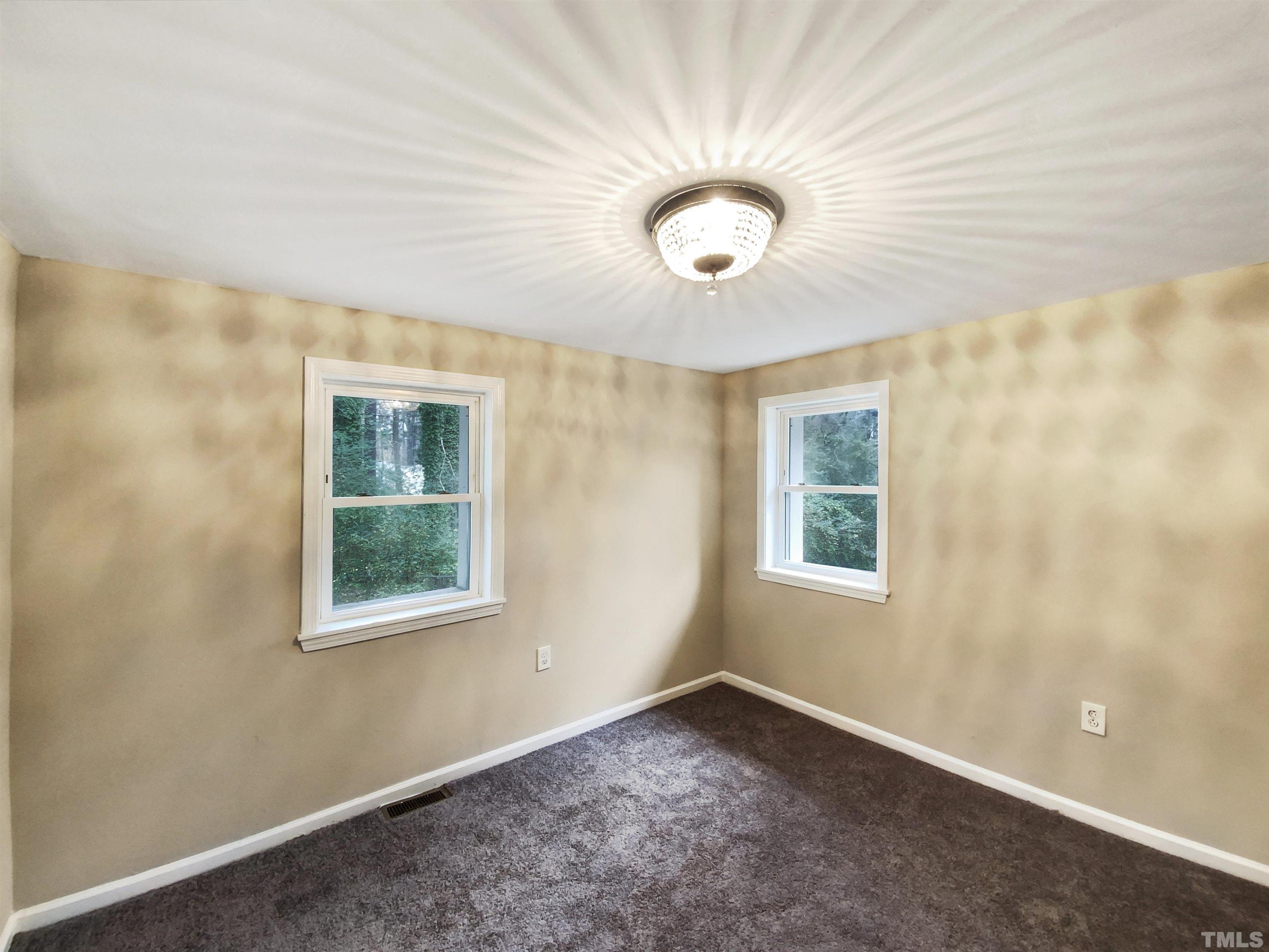 1521 Wiljohn Road Garner, NC 27529 - Photo 5 of 20 an empty room with a window