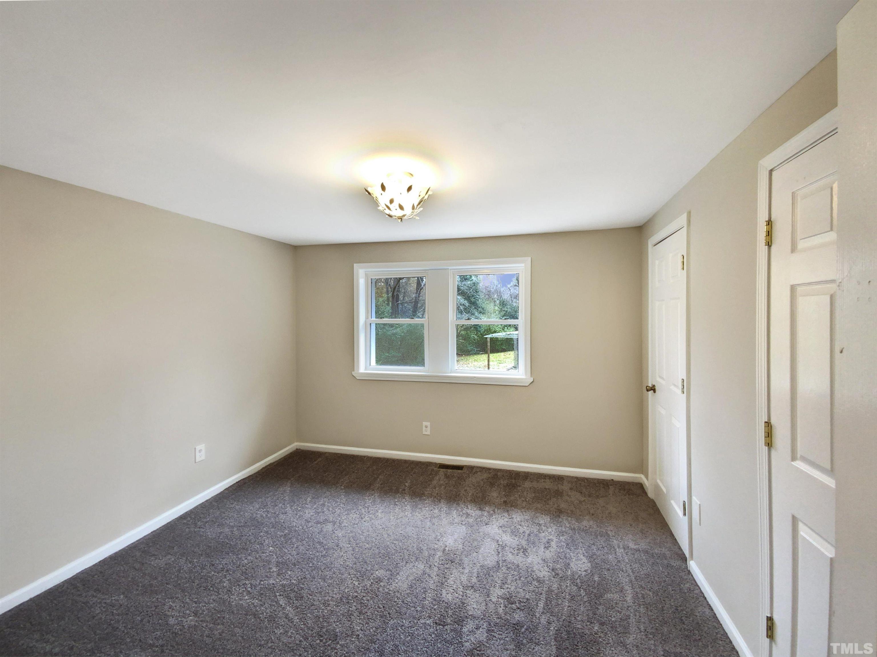 1521 Wiljohn Road Garner, NC 27529 - Photo 7 of 20 a view of an empty room with a window