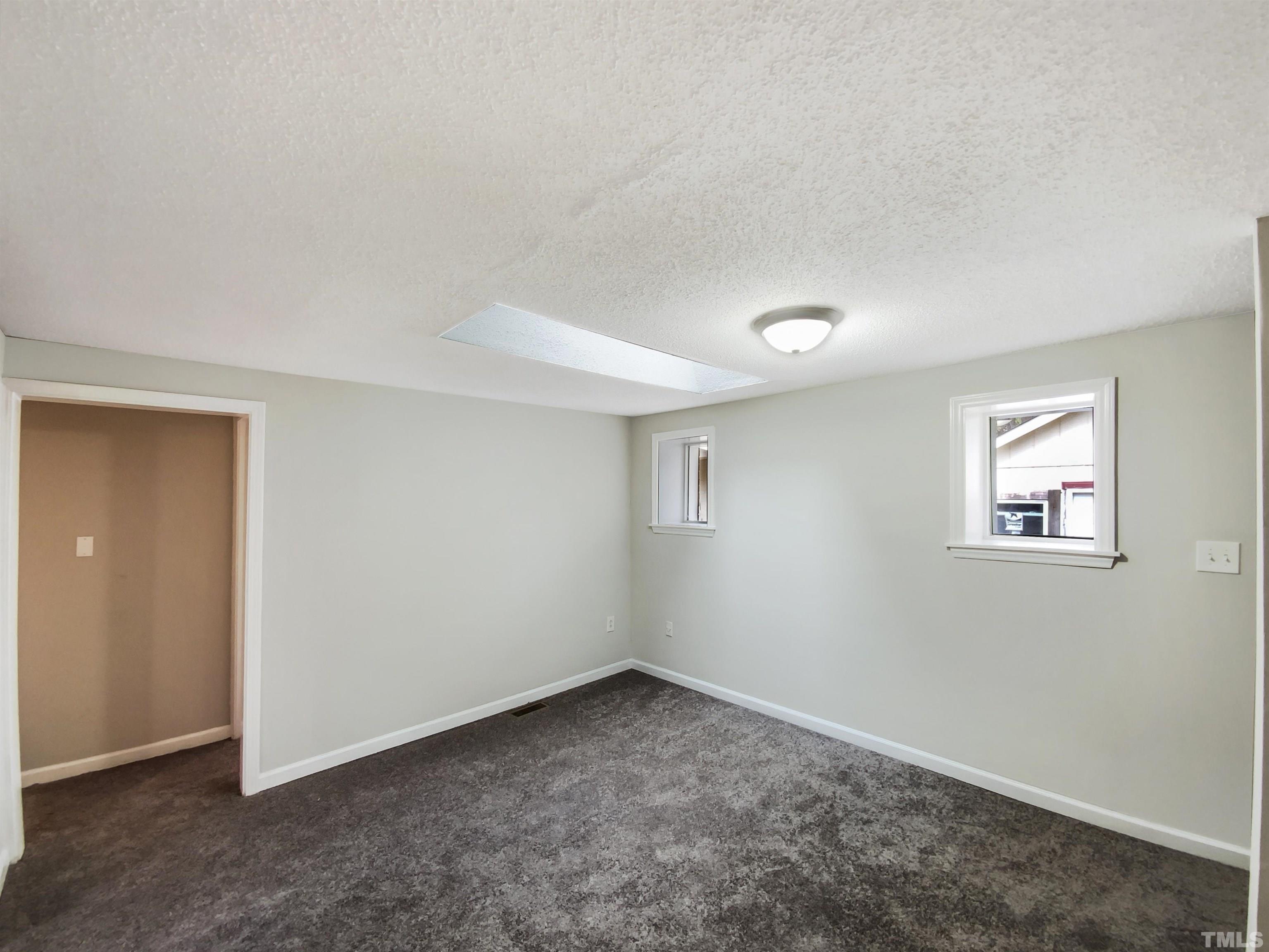 1521 Wiljohn Road Garner, NC 27529 - Photo 8 of 20 an empty room with windows