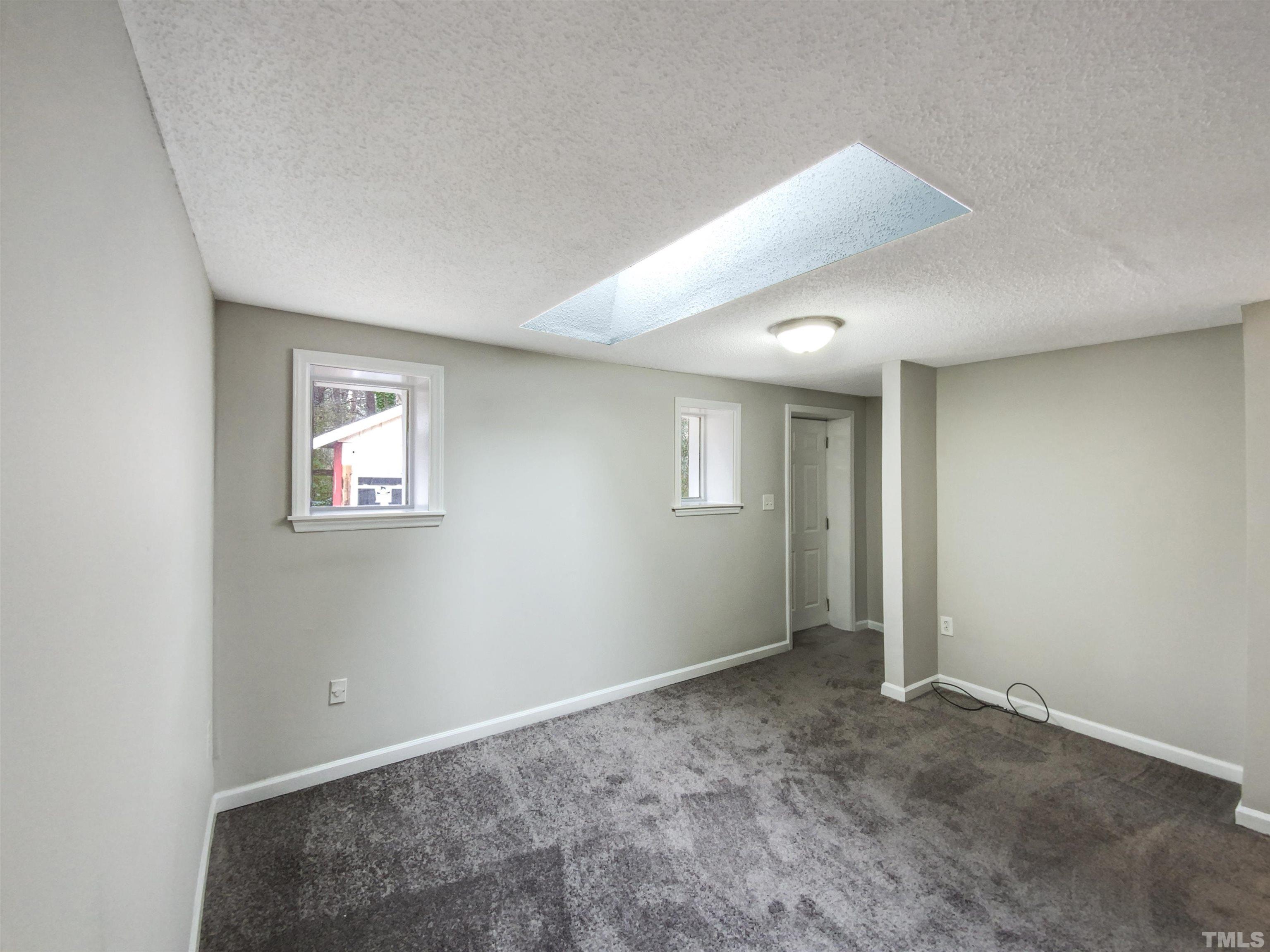 1521 Wiljohn Road Garner, NC 27529 - Photo 9 of 20 a view of an empty room with a window