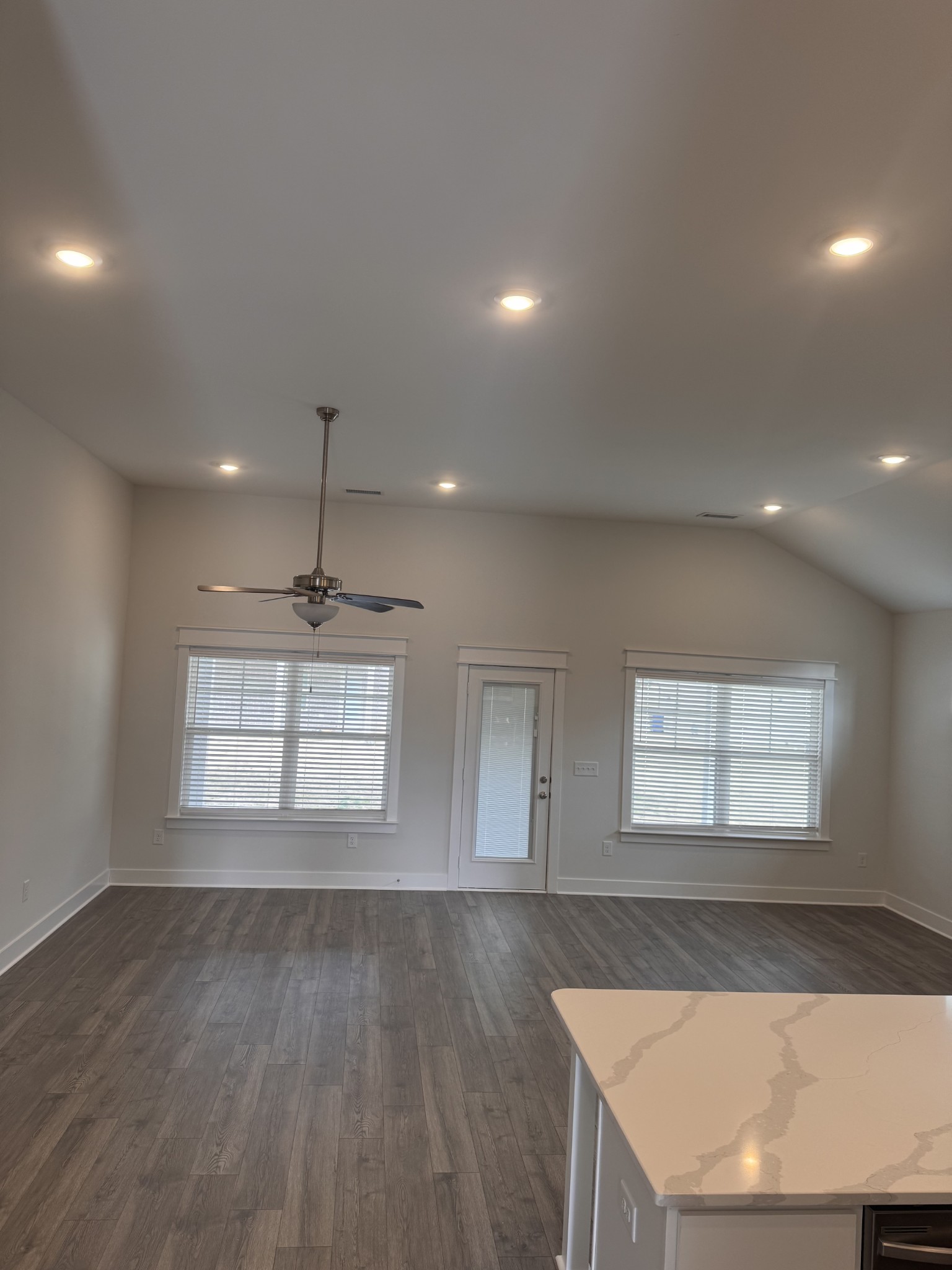 5572 Rooker Road Smyrna, TN 37167 - Photo 4 of 13 an empty room with wooden floor and windows
