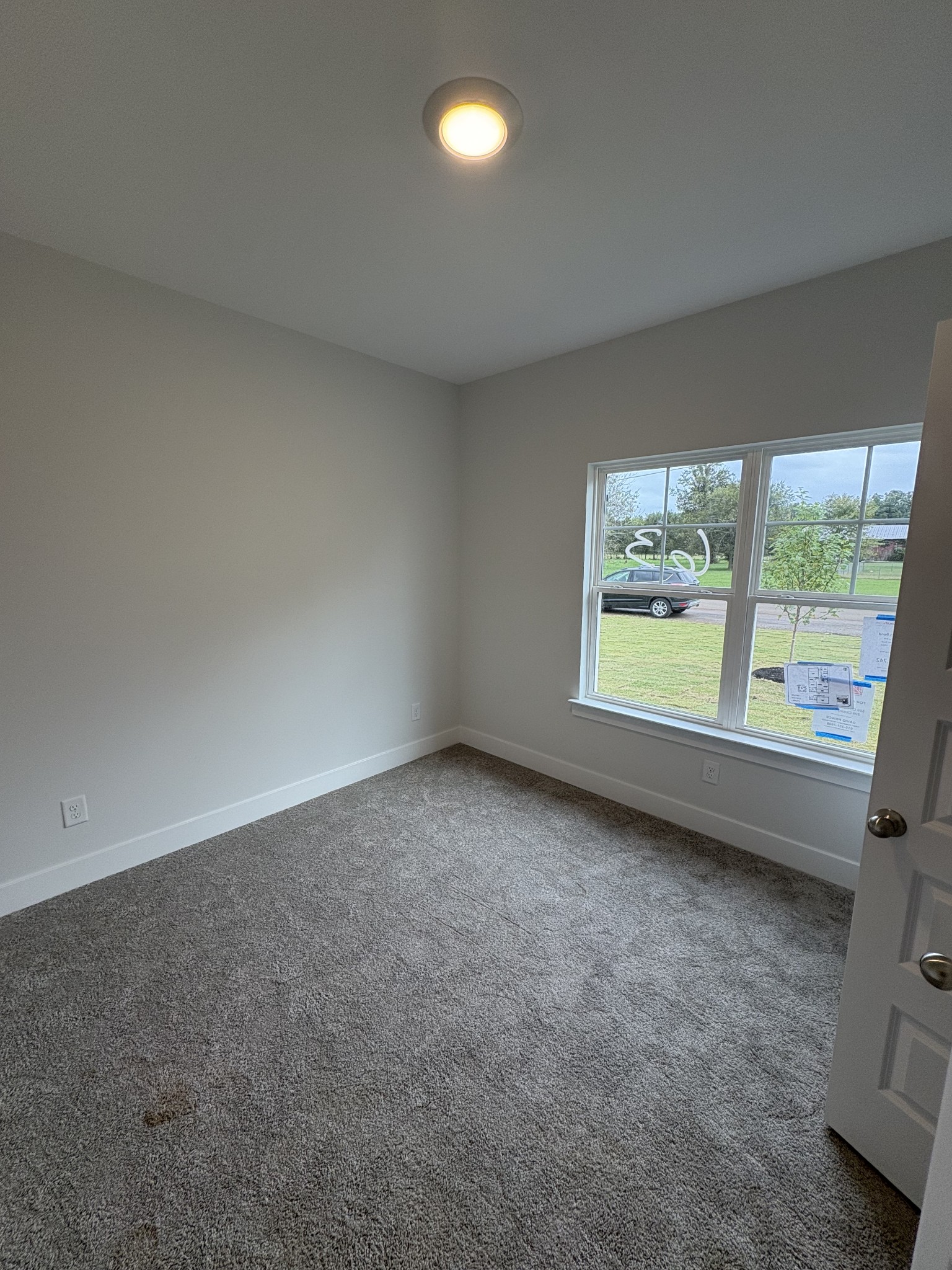 5572 Rooker Road Smyrna, TN 37167 - Photo 5 of 26 an empty room with windows