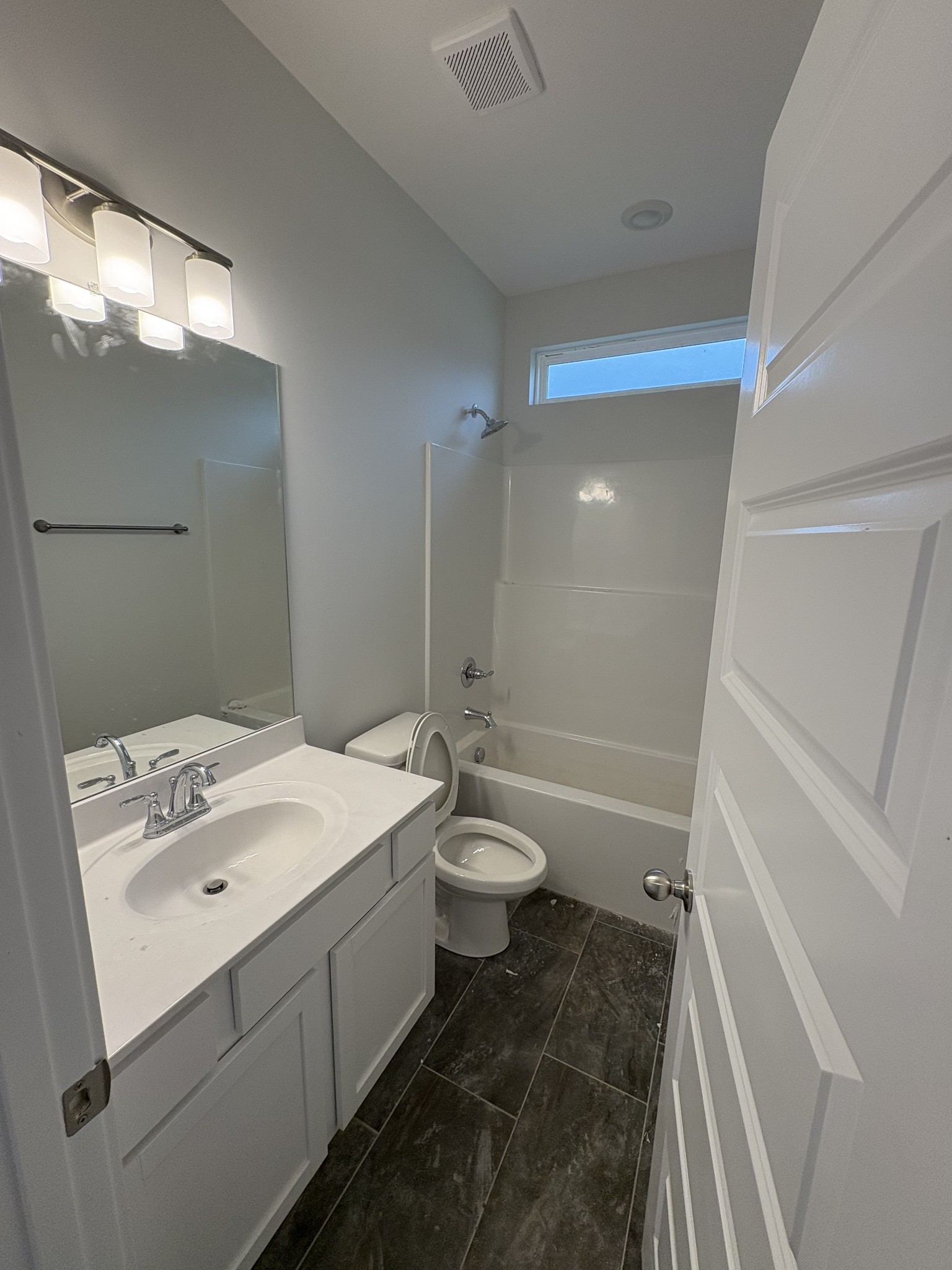 5572 Rooker Road Smyrna, TN 37167 - Photo 6 of 26 a bathroom with a sink a toilet and shower