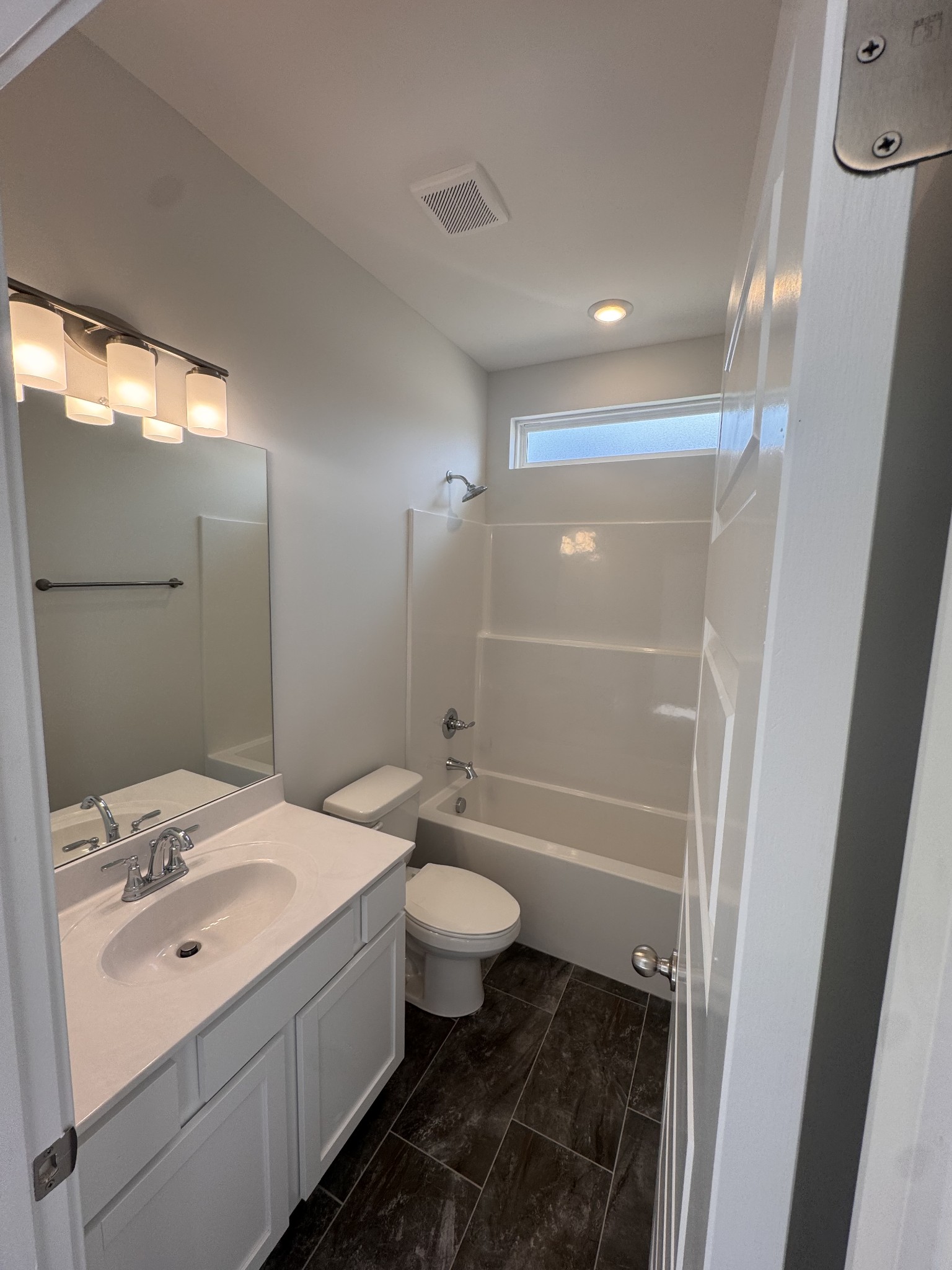 5572 Rooker Road Smyrna, TN 37167 - Photo 8 of 13 a bathroom with a sink a toilet and shower