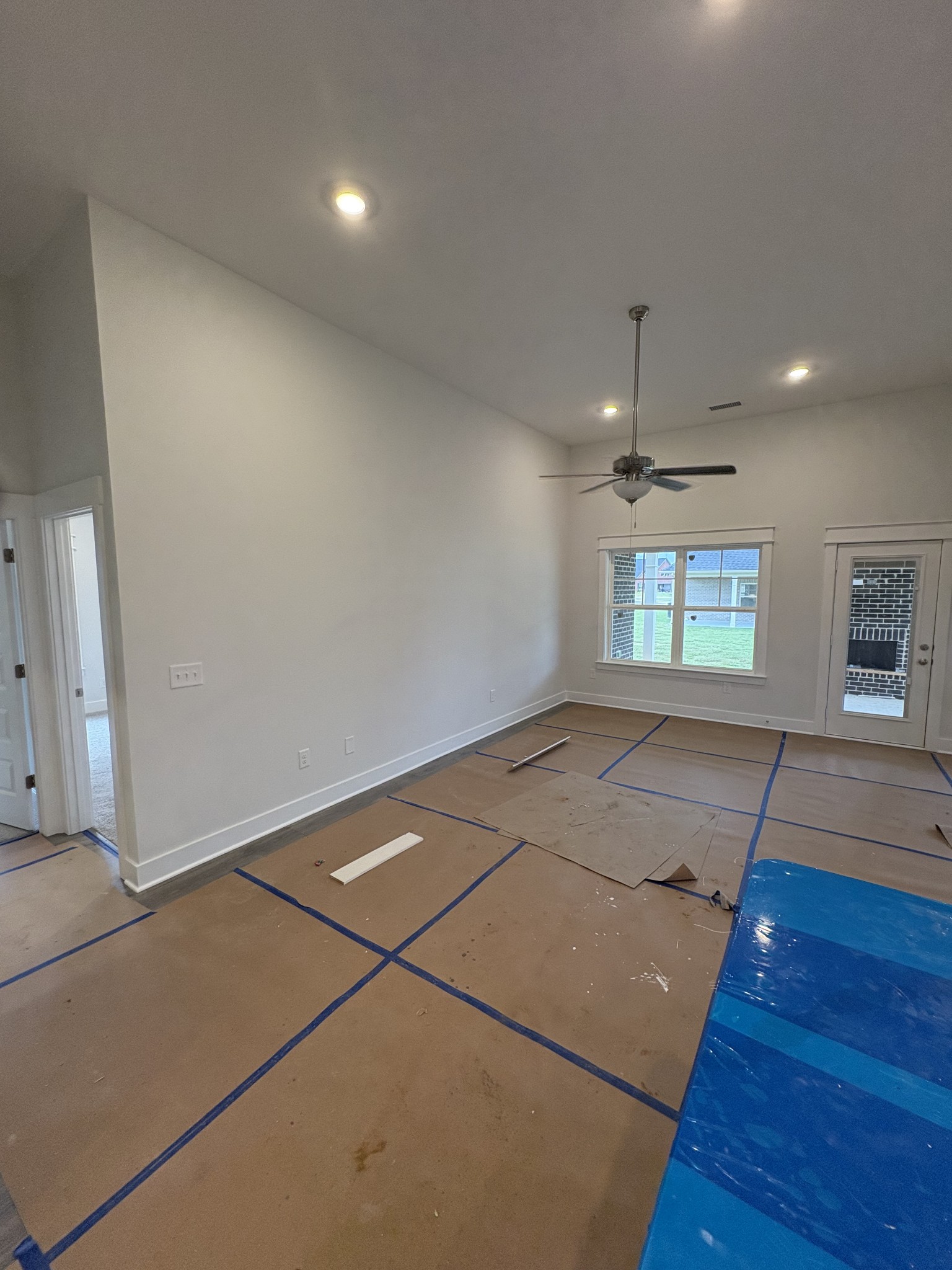 5572 Rooker Road Smyrna, TN 37167 - Photo 9 of 26 an empty room with wooden floor and windows