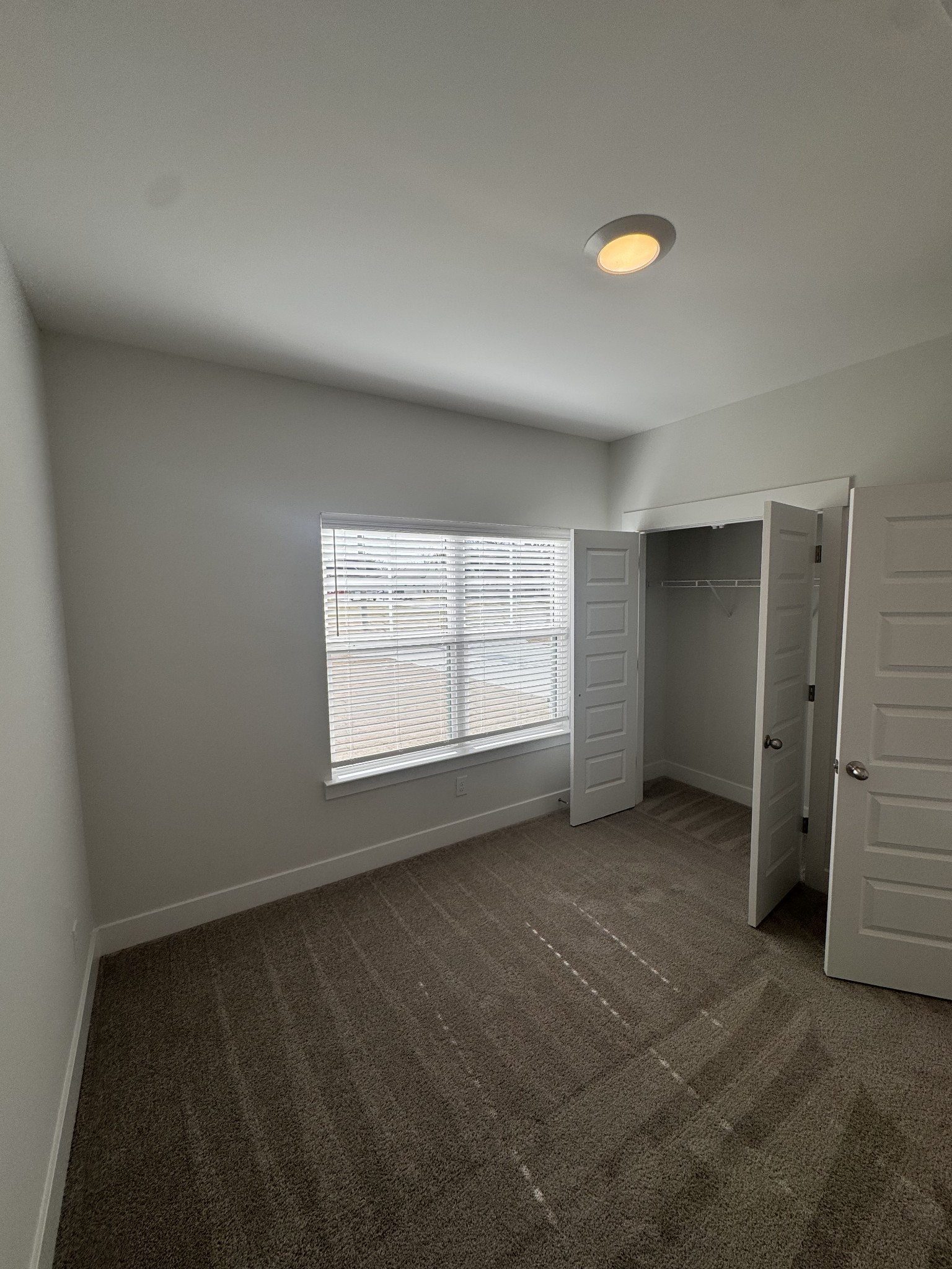 5572 Rooker Road Smyrna, TN 37167 - Photo 9 of 13 an empty room with windows