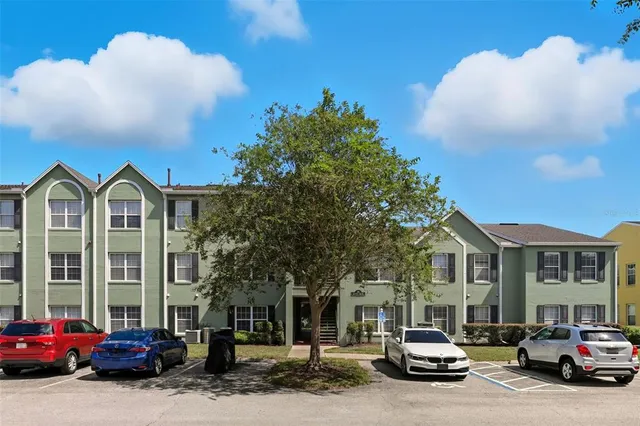 a view of a parked cars in front of a building