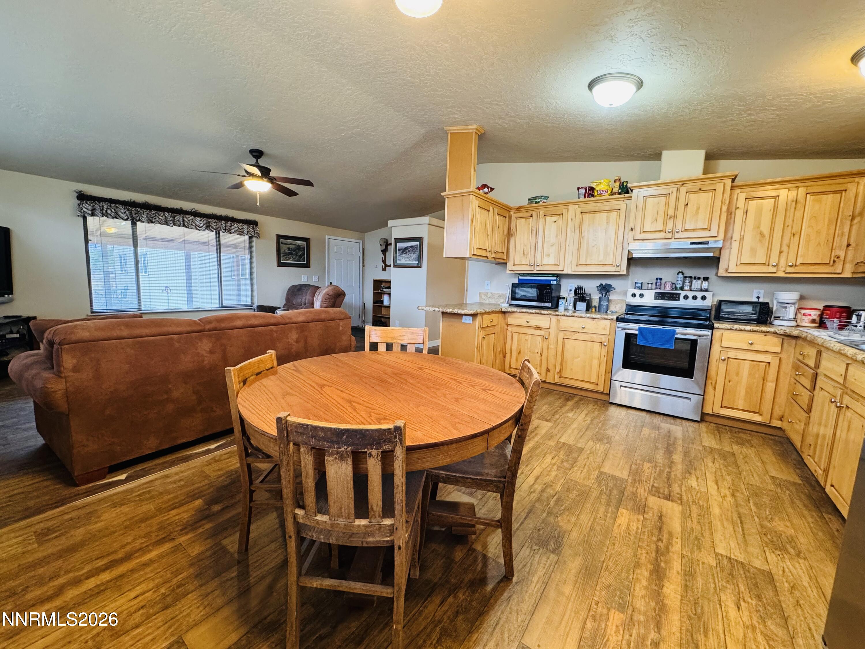 29400 Kings River Road Orovada, NV 89425 - Photo 14 of 40 a large kitchen with cabinets table and chairs