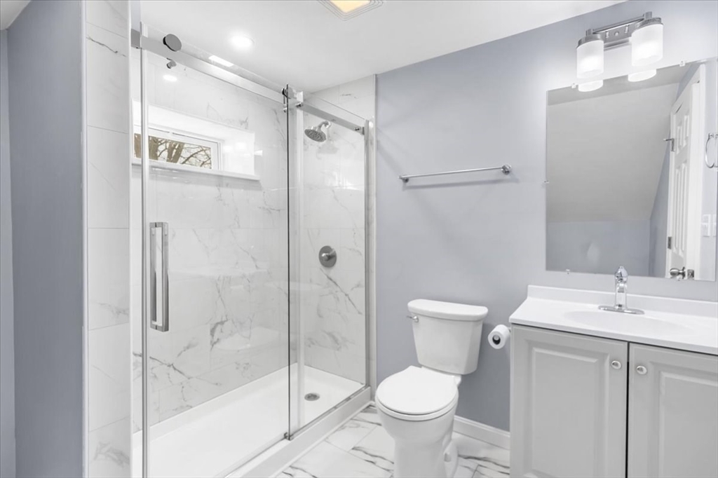 31 Webster Street Winchendon, MA 01475 - Photo 20 of 32 a bathroom with a granite countertop sink toilet and shower