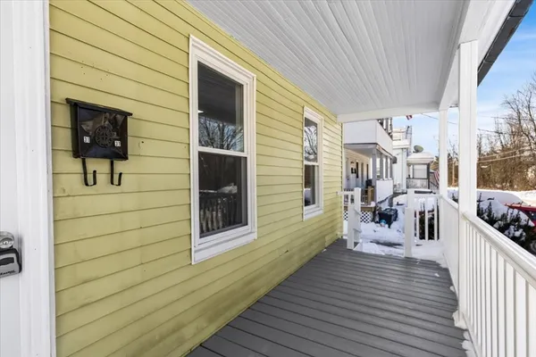 a view of a house with wooden deck
