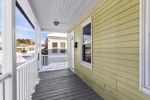 a view of a house with wooden deck