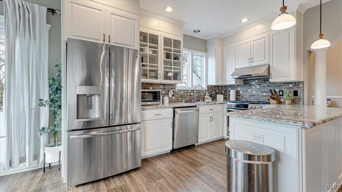 536 Christine Ann Lane Nazareth, PA 18064 - Photo 6 of 47 a kitchen with cabinets stainless steel appliances and wooden floor