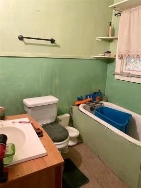 2809 Tuam Street Houston, TX 77004 - Photo 4 of 6 a bathroom with a toilet a sink and mirror
