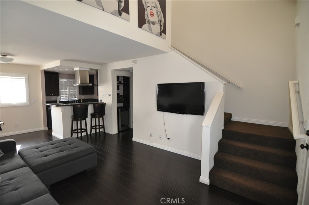 249 Alpine Street, Unit 48 Pasadena, CA 91106 - Photo 6 of 14 a living room with furniture and a flat screen tv