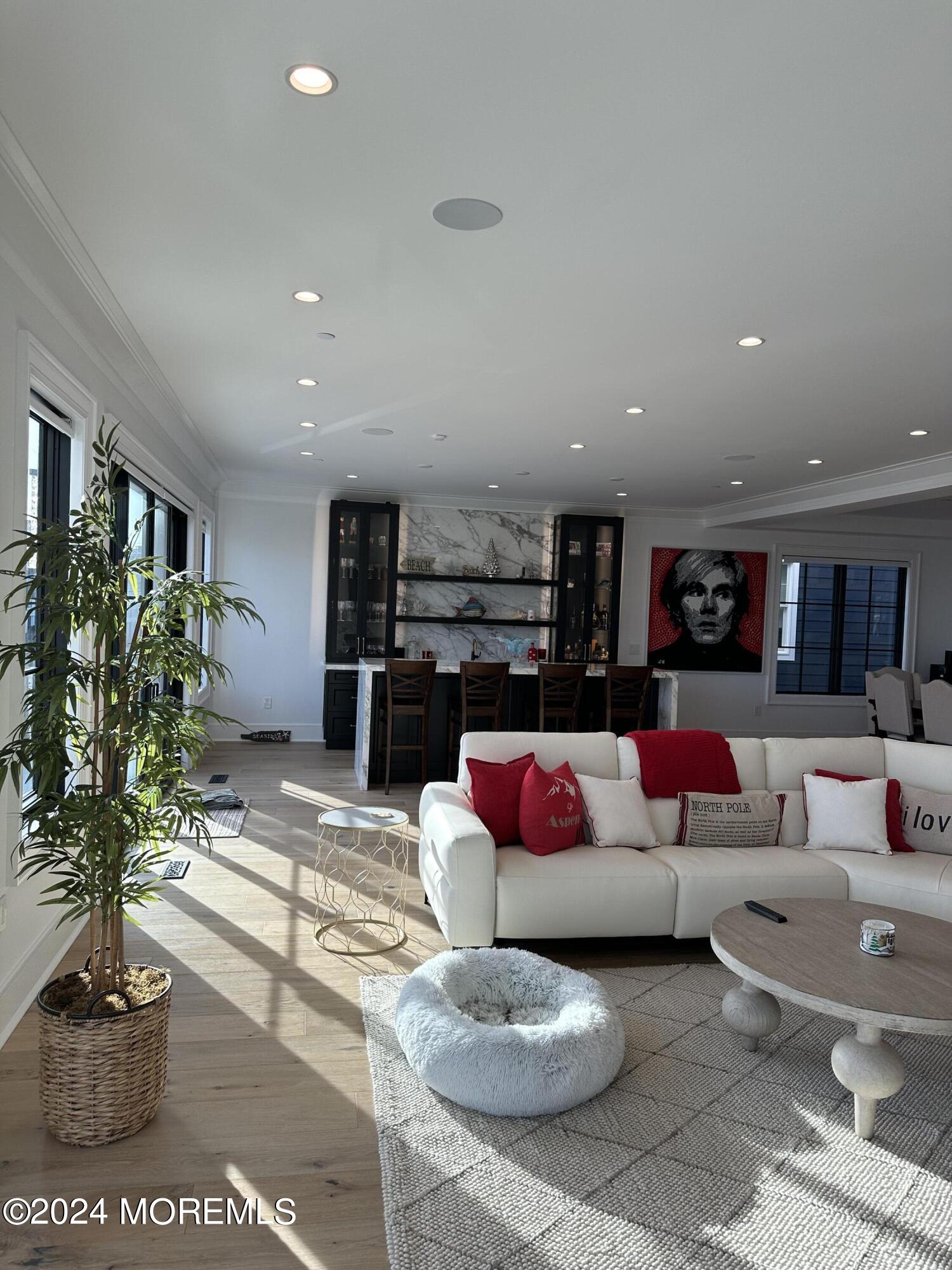13 Ocean Terrace Long Branch, NJ 07740 - Photo 11 of 49 a living room with furniture and a potted plant