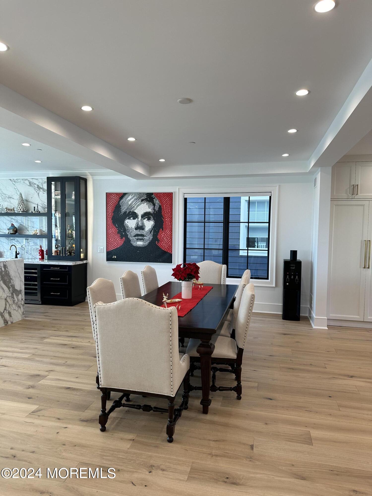 13 Ocean Terrace Long Branch, NJ 07740 - Photo 12 of 49 a living room with furniture a rug and kitchen view