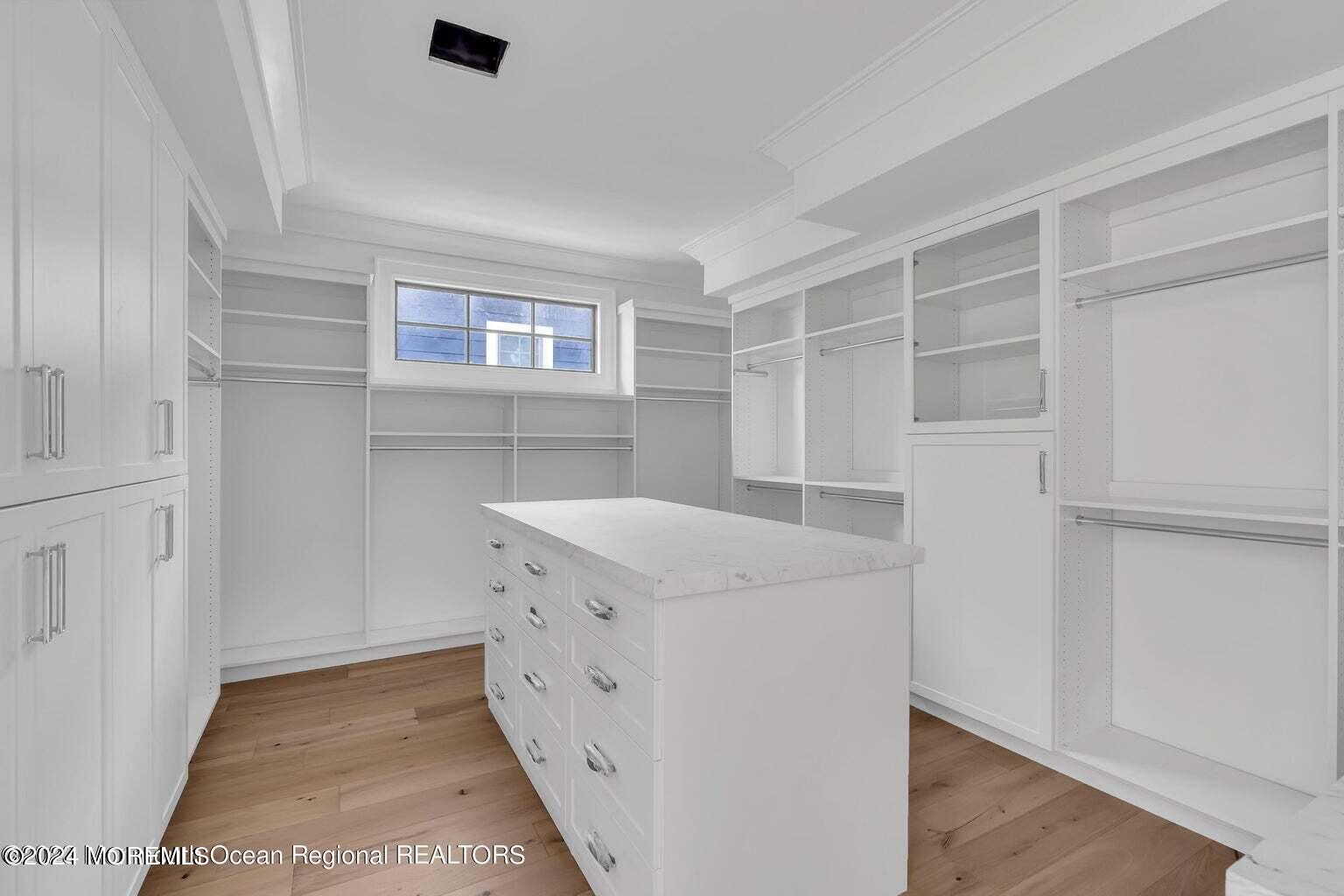 13 Ocean Terrace Long Branch, NJ 07740 - Photo 28 of 49 a utility room with cabinets washer and dryer
