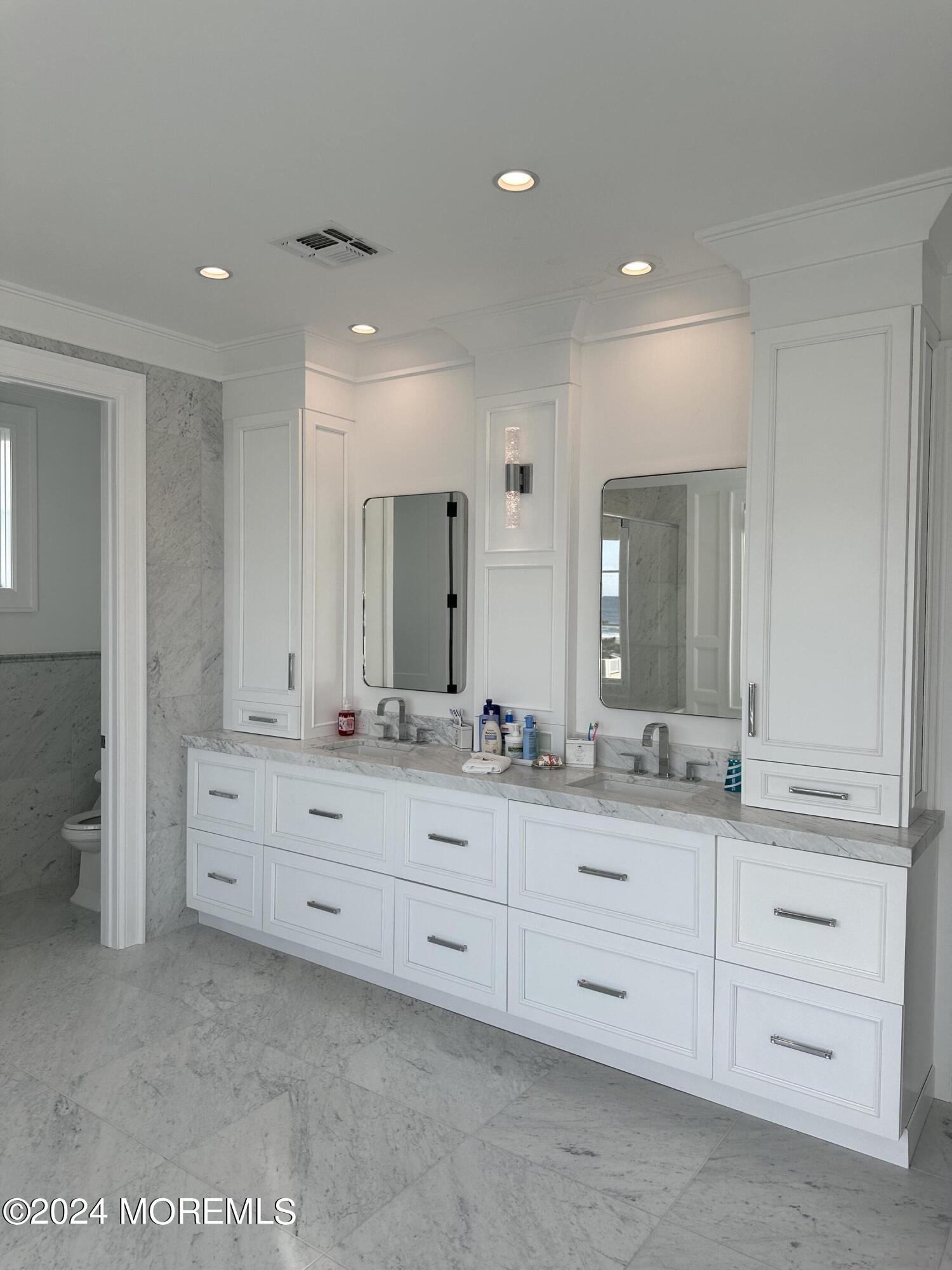 13 Ocean Terrace Long Branch, NJ 07740 - Photo 30 of 49 a bathroom with double sink and a mirror
