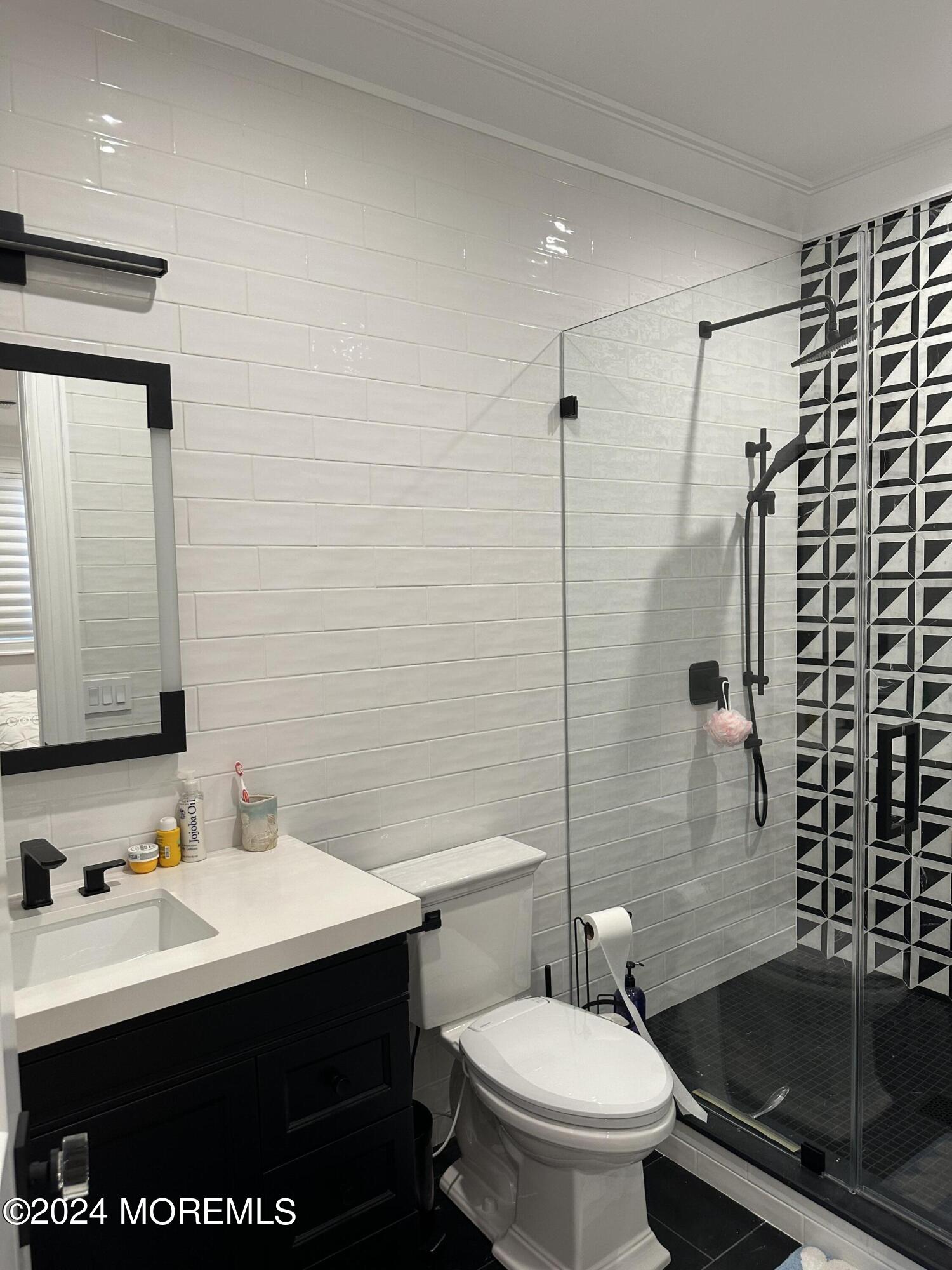 13 Ocean Terrace Long Branch, NJ 07740 - Photo 34 of 49 a bathroom with a sink toilet and shower