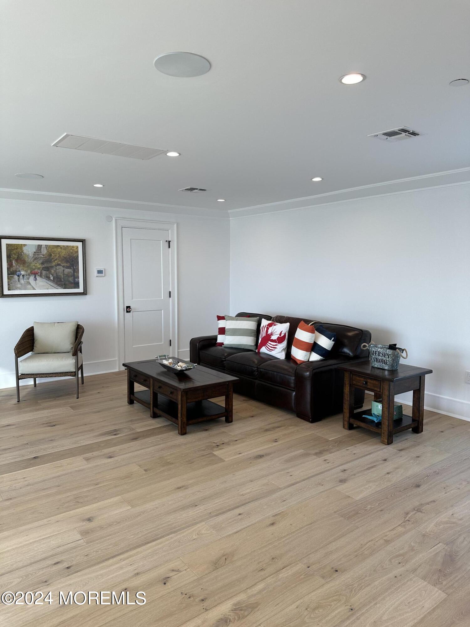 13 Ocean Terrace Long Branch, NJ 07740 - Photo 36 of 49 a living room with furniture and wooden floor