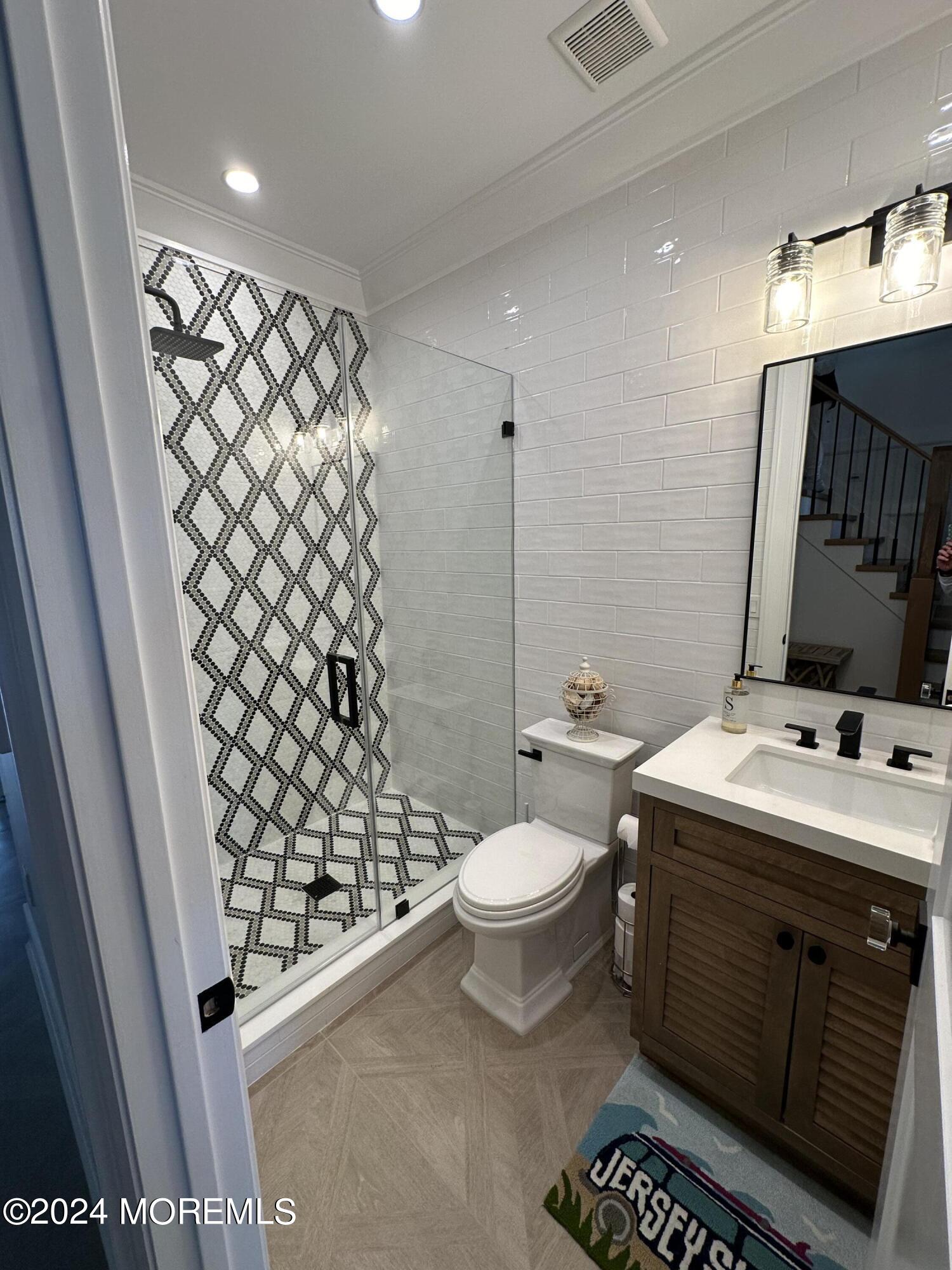 13 Ocean Terrace Long Branch, NJ 07740 - Photo 37 of 49 a bathroom with a sink toilet and shower