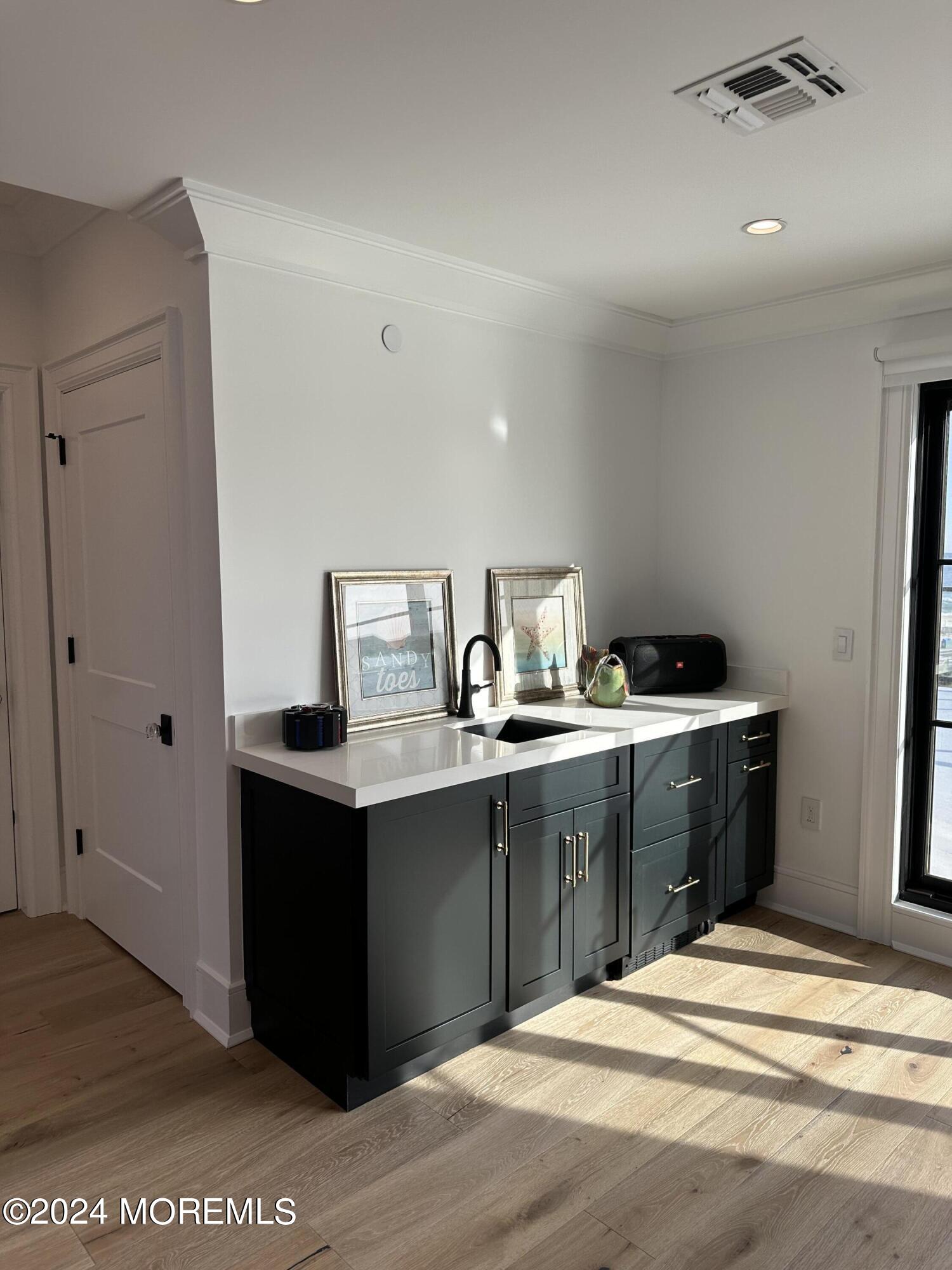 13 Ocean Terrace Long Branch, NJ 07740 - Photo 40 of 49 a kitchen with a sink and cabinets